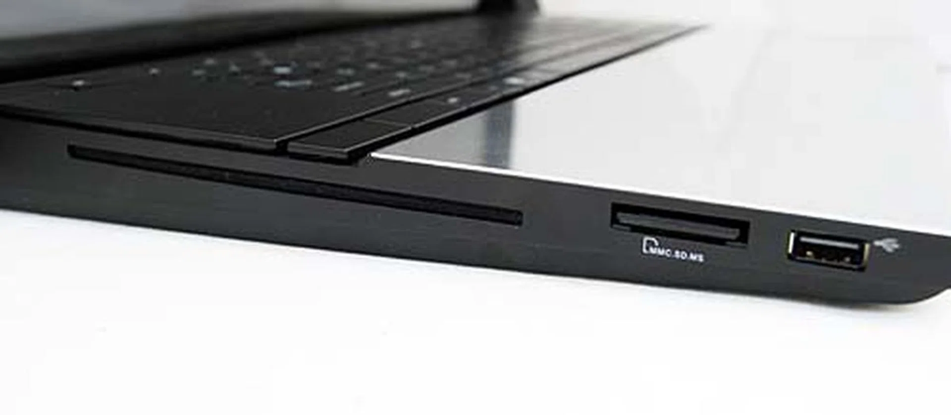 On the left side is the slot loaded Blu-ray DVD combo drive, SD card reader and another USB port.