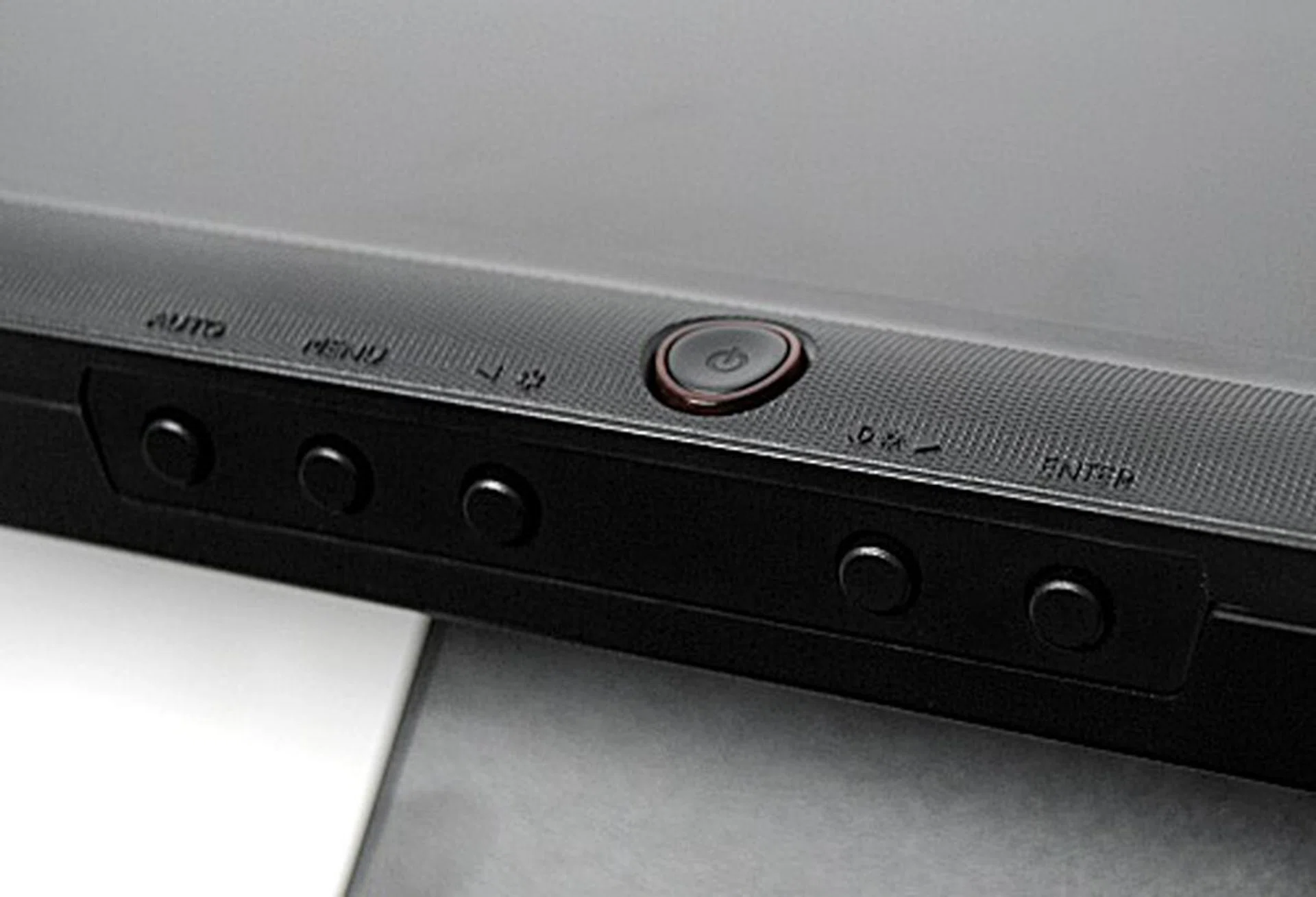 Seen here are the buttons which control the OSD. While the inscriptions for the buttons are readable from this angle, we found them difficult to discern when the monitor is standing upright. The placement of the buttons also makes navigating the OSD tricky.