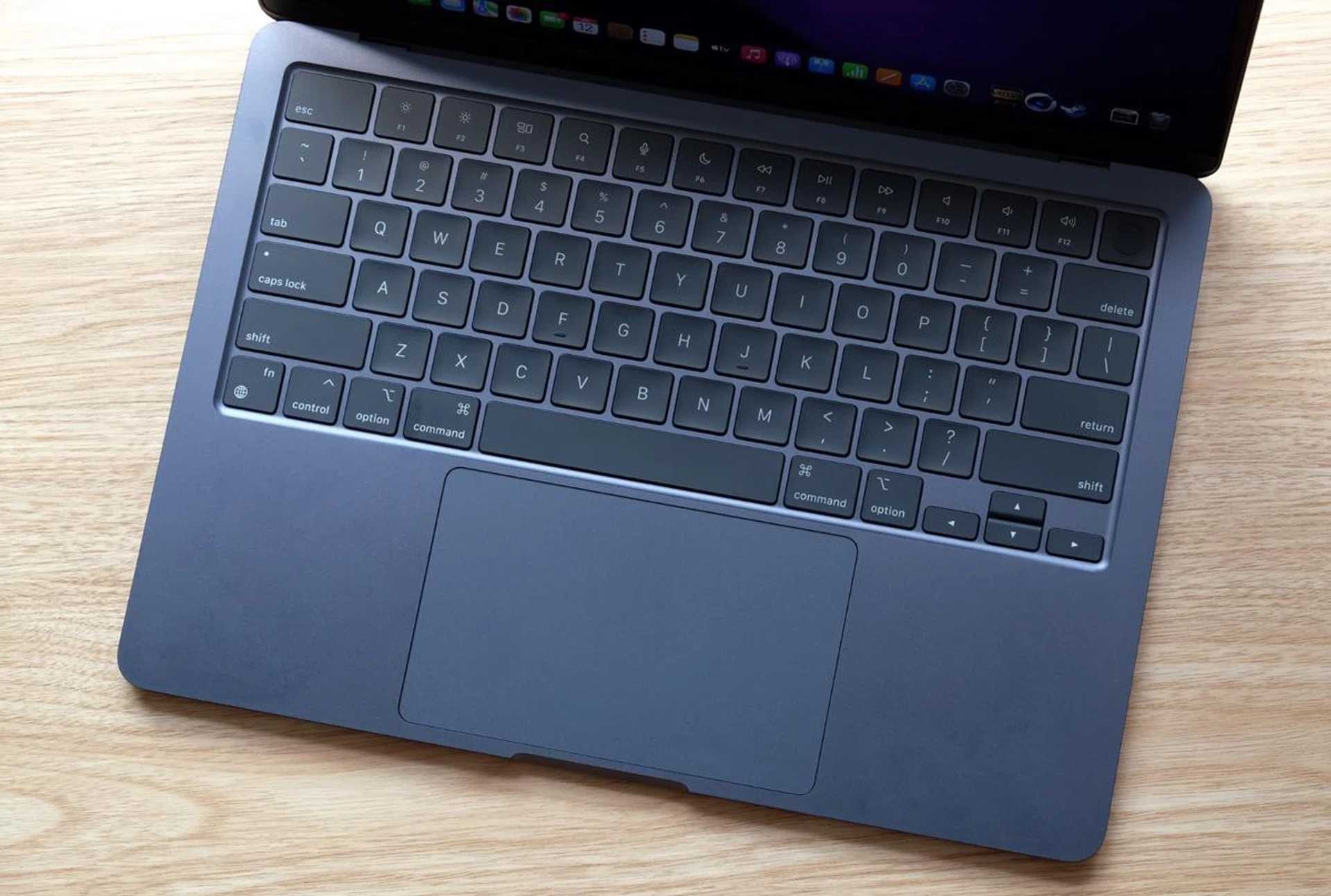 The keyboard has traditional scissors=style switches and a full-height row of function keys. Touch ID in the top right corner makes for quick and easy log-ins.