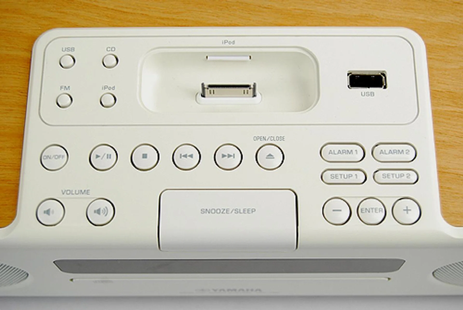 You'll find a load of buttons to access the TSX-130's various features. Note the iPod/iPhone docking connector and USB port for USB flashdrive playback.
