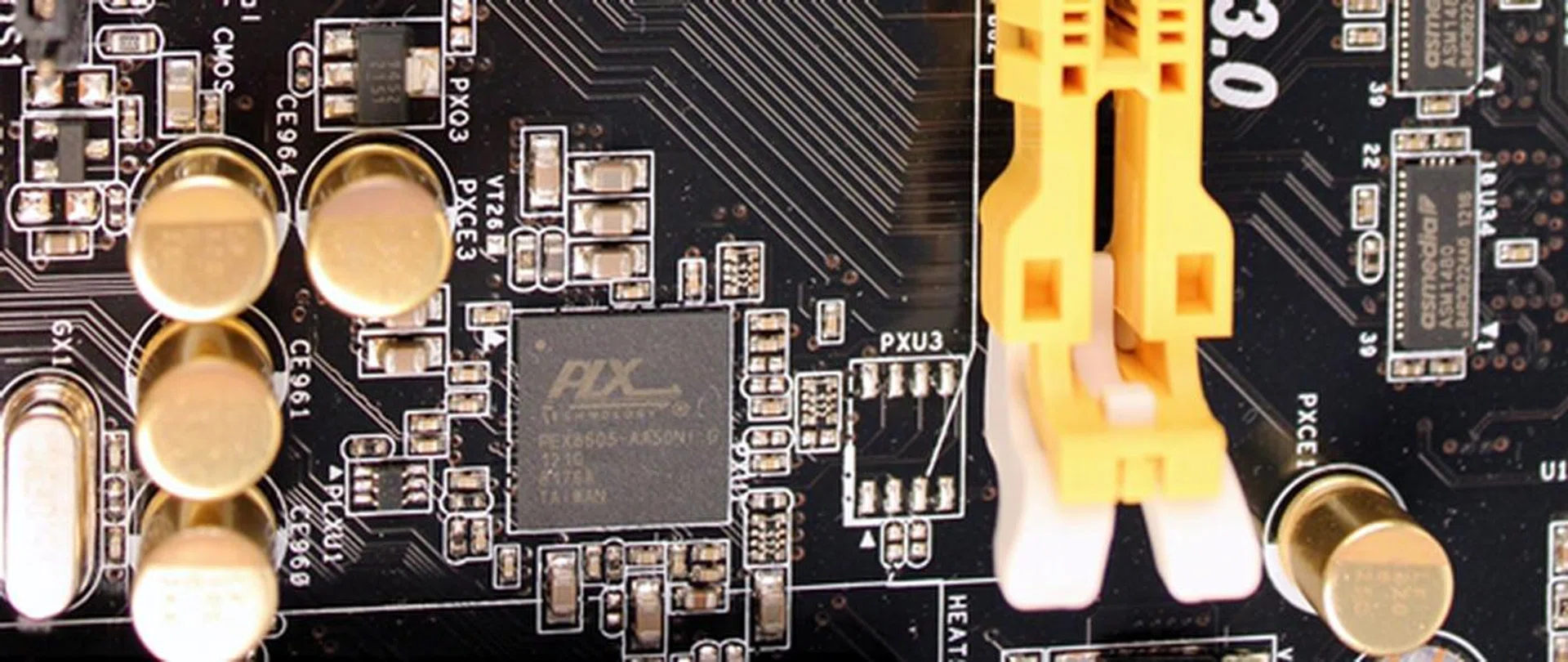 The PLX PEX 8605 switch chip that adds four additional PCIe 2.0 lanes to the board.