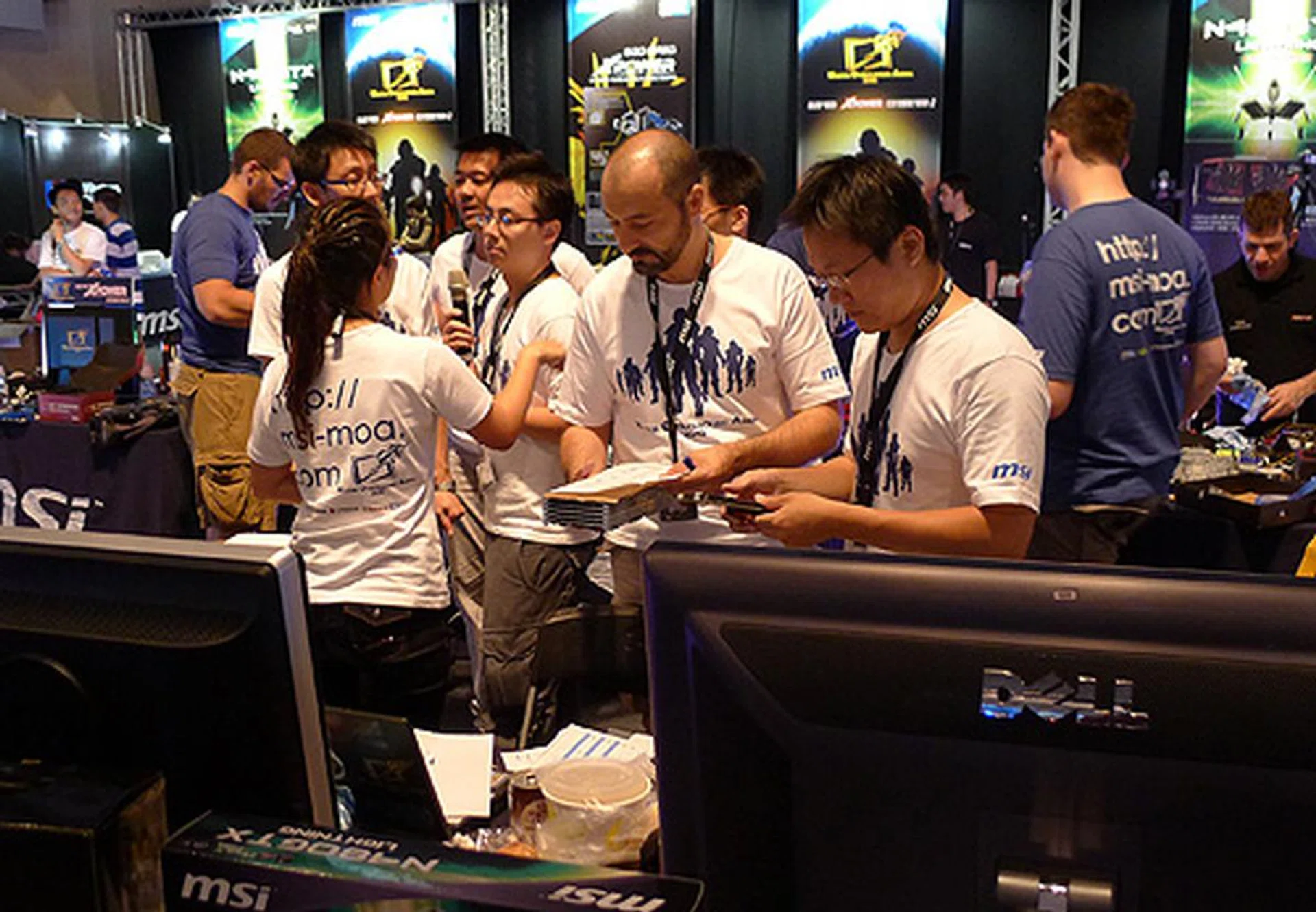 Overall judge for the event Giorgioprimo and officials from MSI congregate to finalize scores.