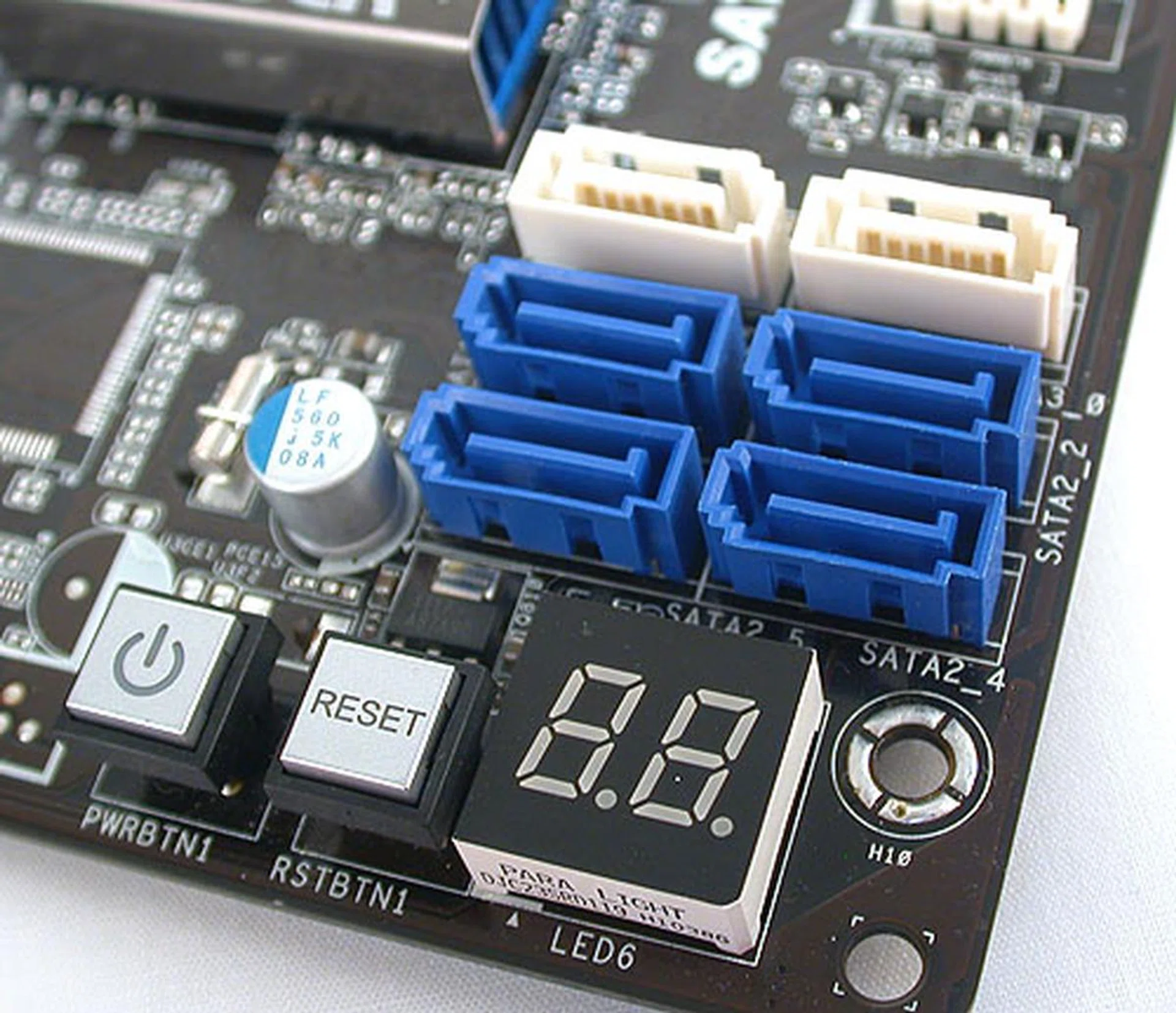 Only the standard 4+2 SATA port configuration is found on this ASRock board, all sustained by the chipset, presumably to reduce cost. There are onboard power and reset buttons and even a debugging LED panel. Not exactly what we expected from a mainstream, cost-conscious board.