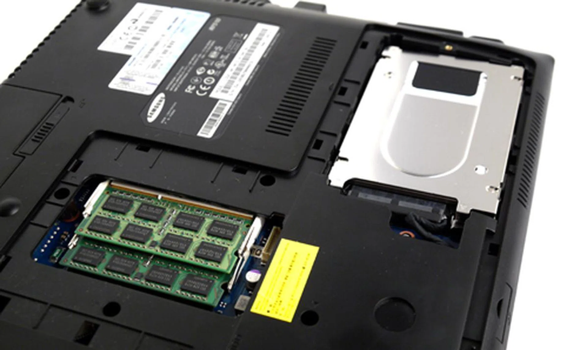 Behold! Two RAM modules (4GB+2GB) which gives you a glorious 6GB memory in total. That shiny thing hides the laptop's 500GB hard drive, which sadly, offers a slower 5400rpm spin rate compared to 7200rpm iterations often found on desktop systems.