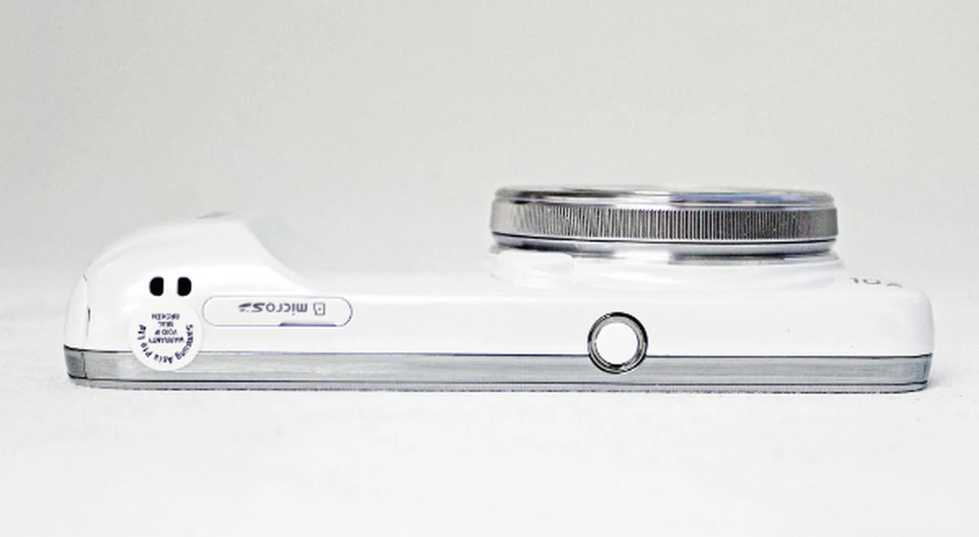 On the left spine is the microSD card slot and the tripod mount socket. 