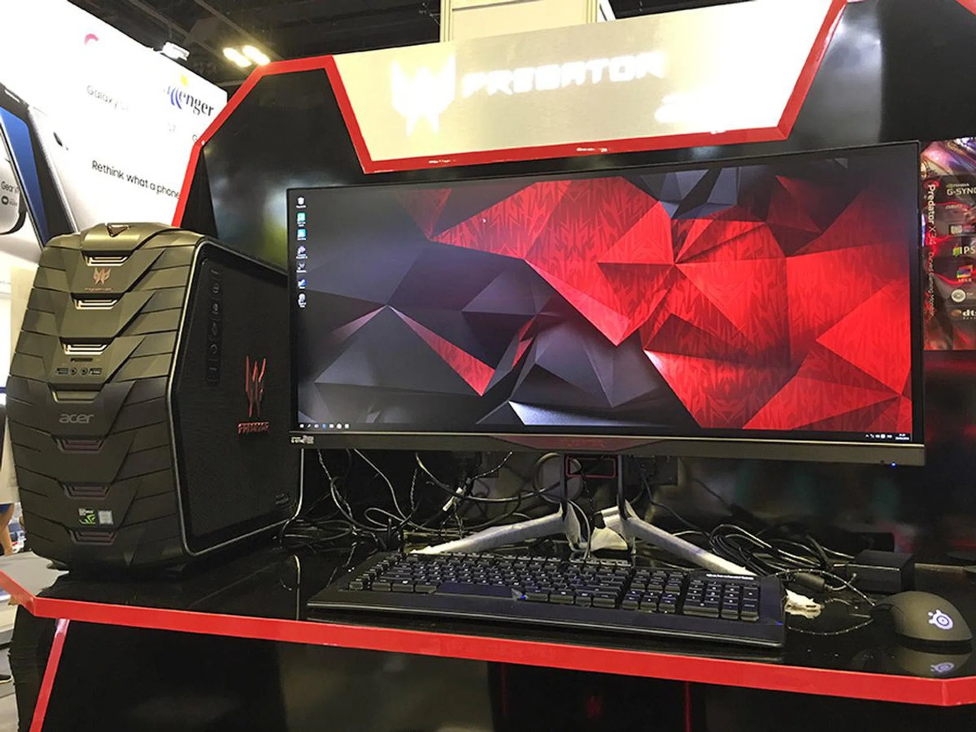 The Acer X34 is a giant 34-inch QHD curved monitor that supports NVIDIA G-Sync. It supports HDMI, DisplayPort, and has a built-in 4-port USB 3.0 hub. Going for $1,499 at the show (down from $1,699), but you can knock a further $100 off if you buy an Acer gaming desktop.