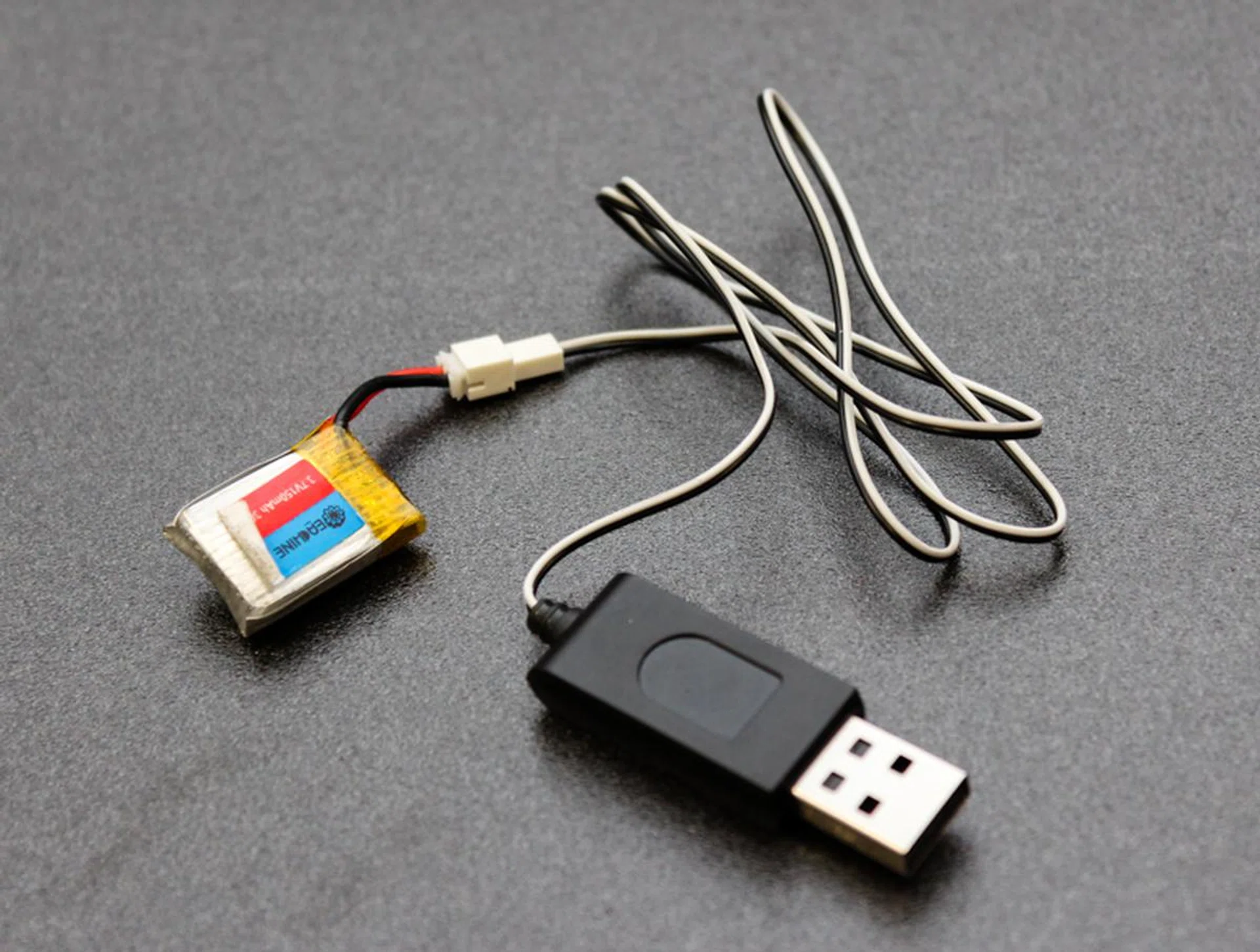 The E010 uses a standard USB charger for its small batteries.