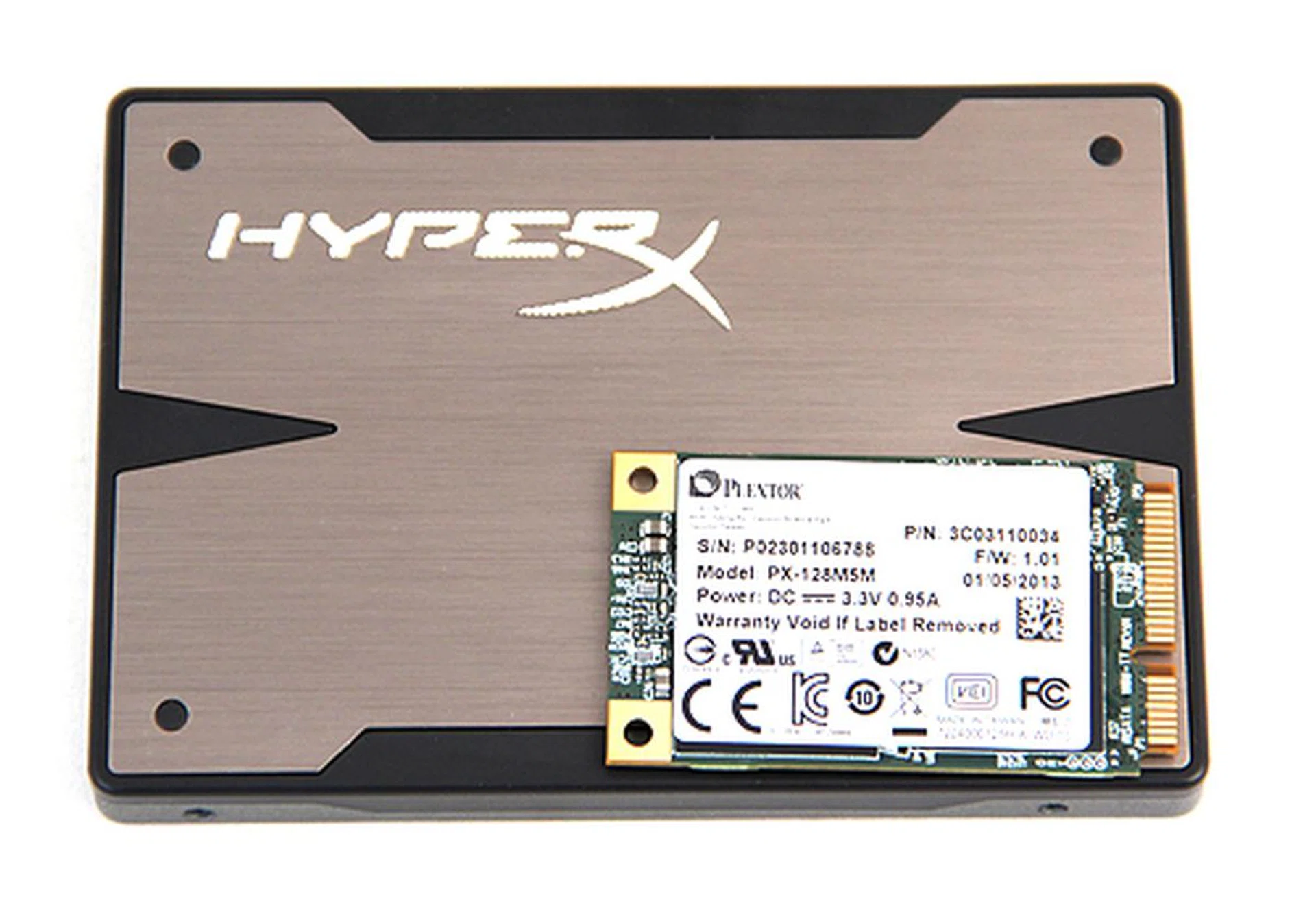 For those who've not seen or dealt with mSATA devices, here's the Plextor M5M juxtaposed with a typical 2.5-inch form factor SSD. Look at how much smaller it is.