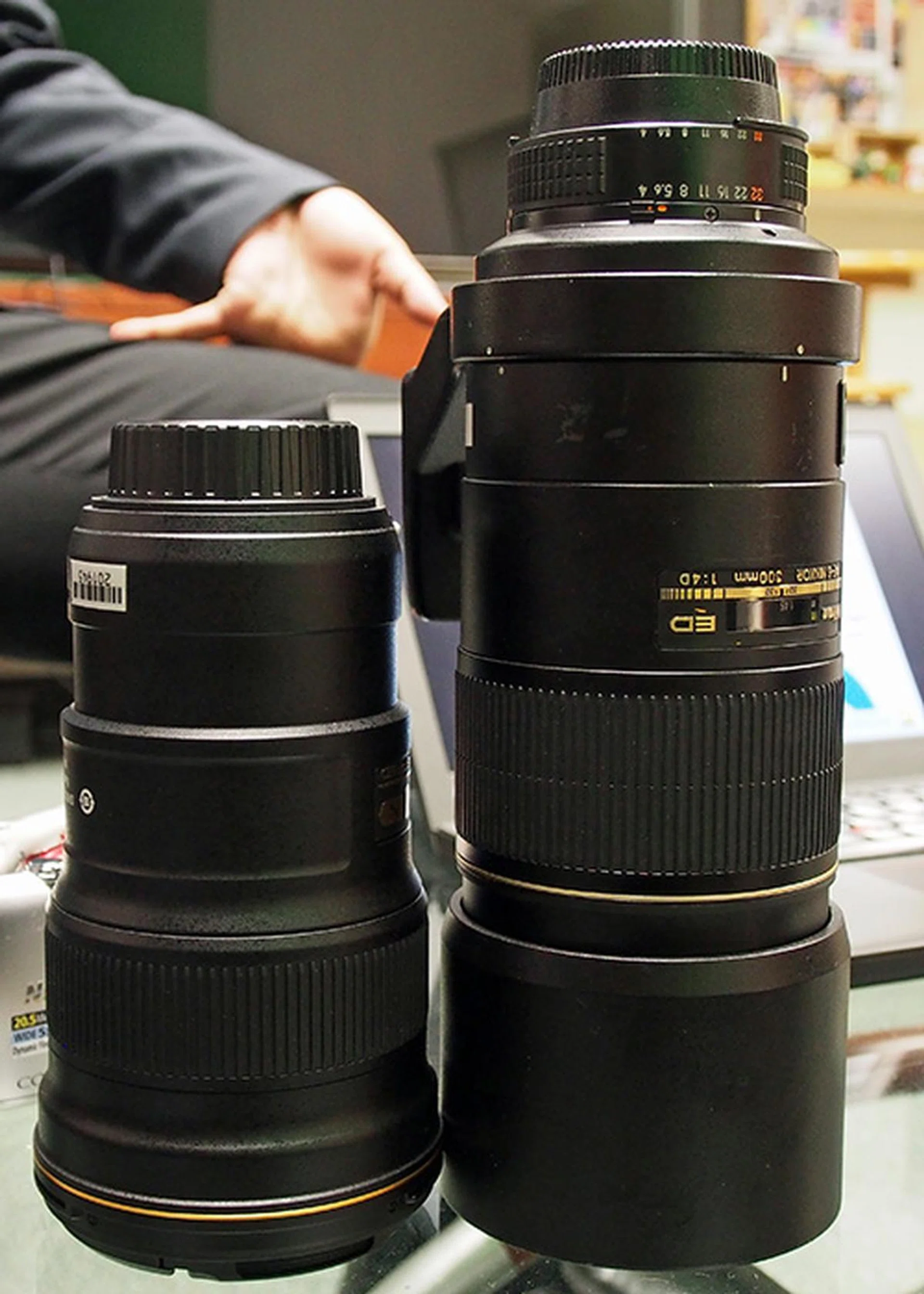 Side-by-side: the new Nikon 300mm f/4 and the one from the previous generation. 