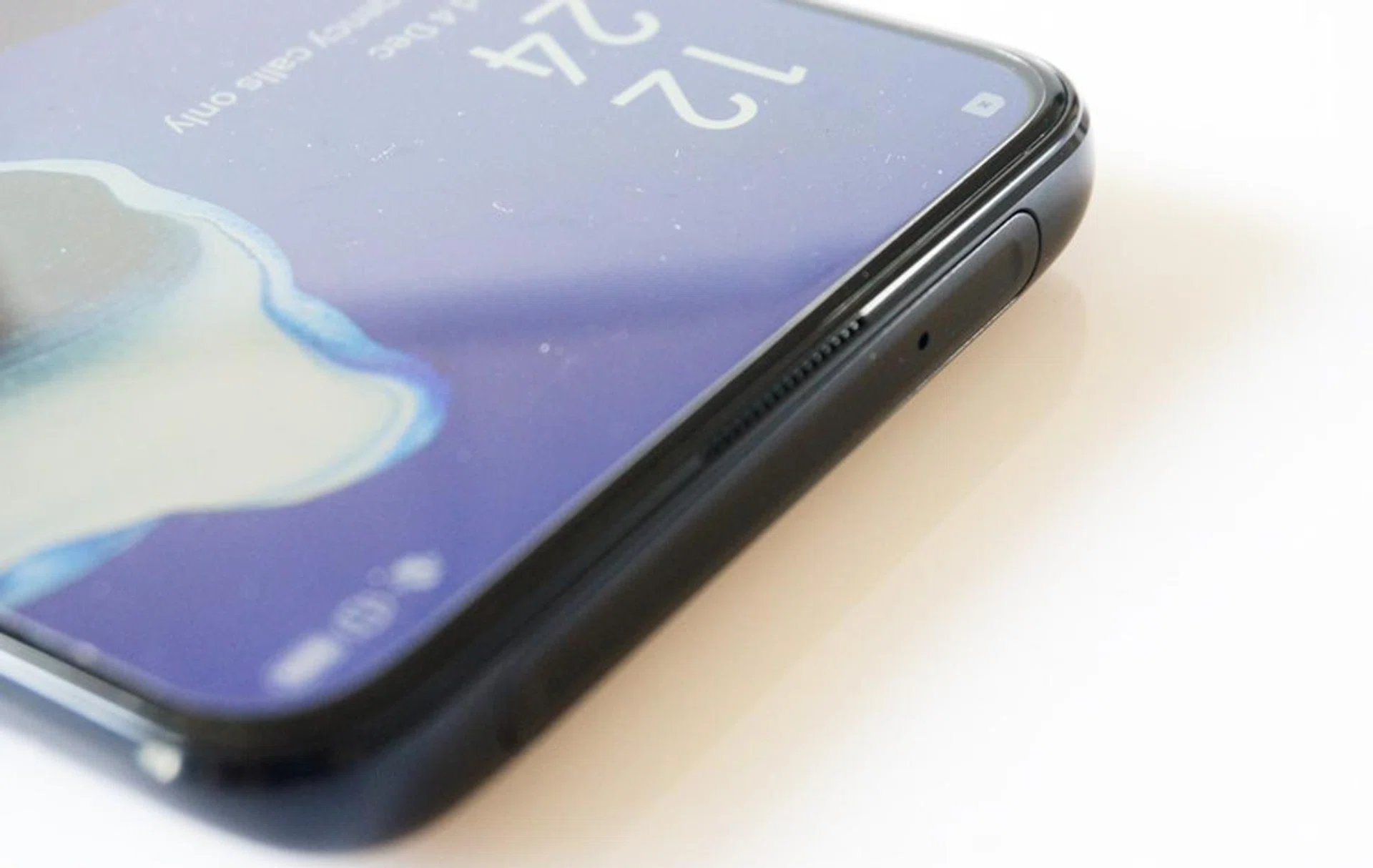 The pop-up camera seems to take up valuable space needed for a better top speaker.