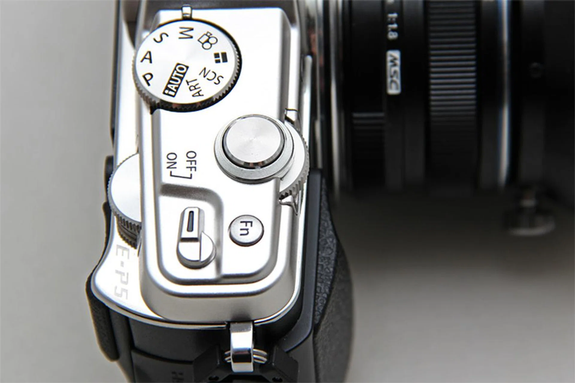The E-P5 sports proper twin control dials, heads above the tall cylinder control dial of the E-P3.