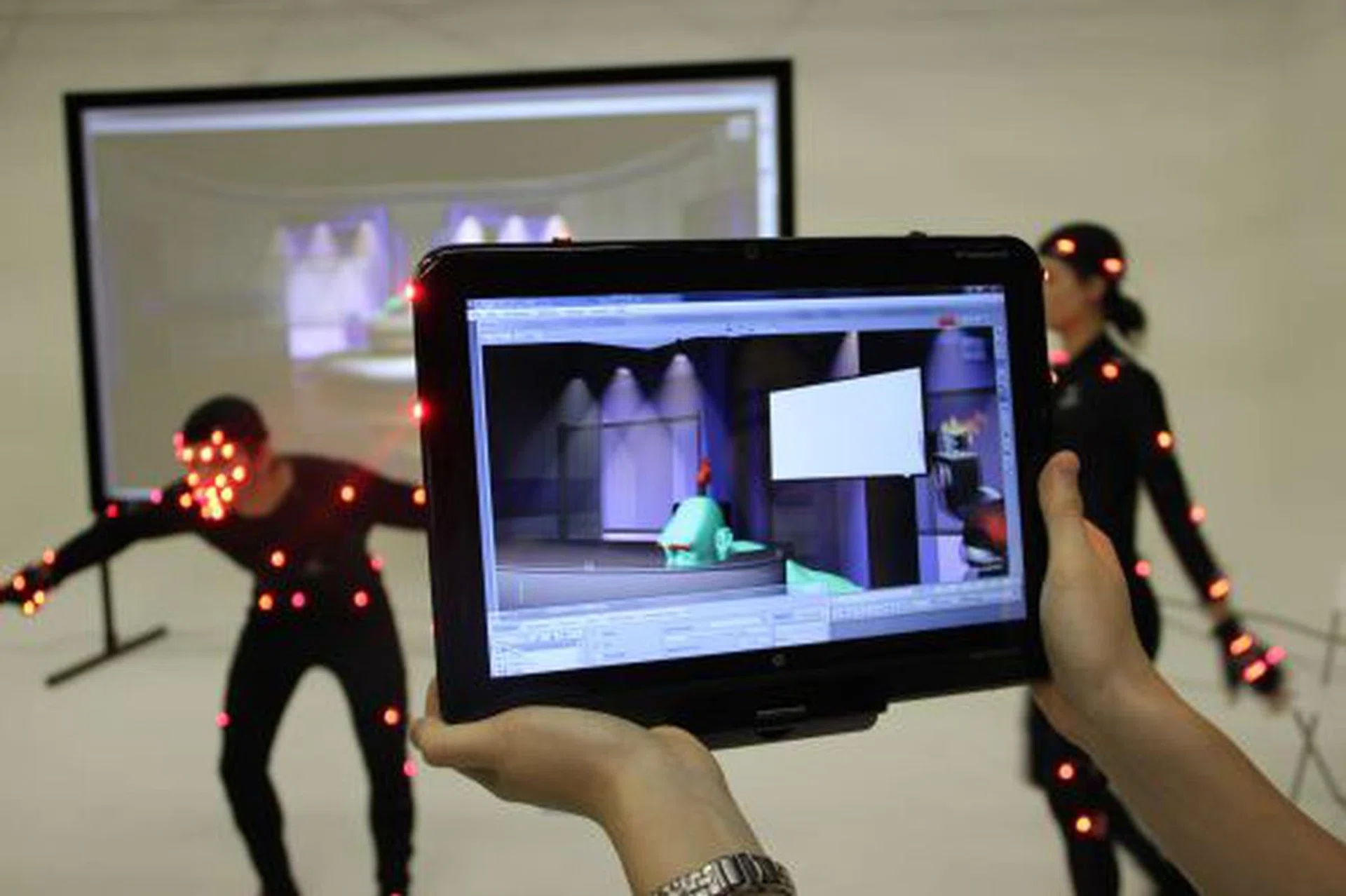 Shown at a demo by PhaseSpace, a vendor of motion capture solutions, is a HP TouchSmart tm2 acts as a virtual camera, letting you see what the director and cameraman sees, while the actors outfitted with the motion capture sensors continue moving about.