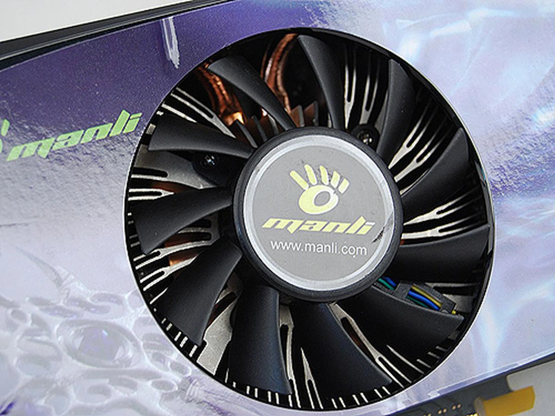 Peering closely, we see that it uses the same radial design heatsink as the reference card.