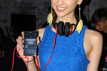 This pretty lady is holding up the new Sony Walkman NWZ-Z1050, an Android-based portable music player.