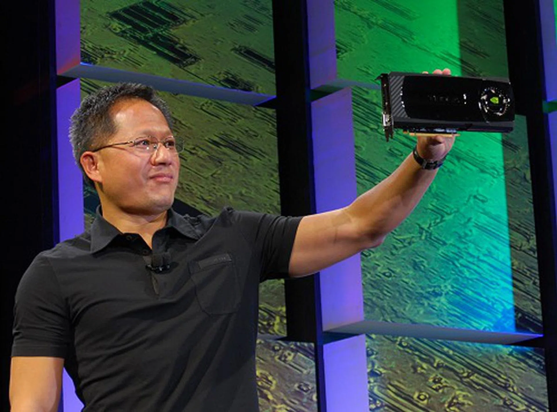 NVIDIA CEO and Co-Founder, Jen-Hsun Huang proudly showing off the new GT300 based graphics card whose architecture is codenamed Fermi and will be the base for all new GeForce, Quadro and Tesla class products coming in the near future.