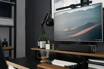 An under-monitor speaker like the Creative Stage SE can fit easily into your current workspace without any clutter. (Image source: Creative)