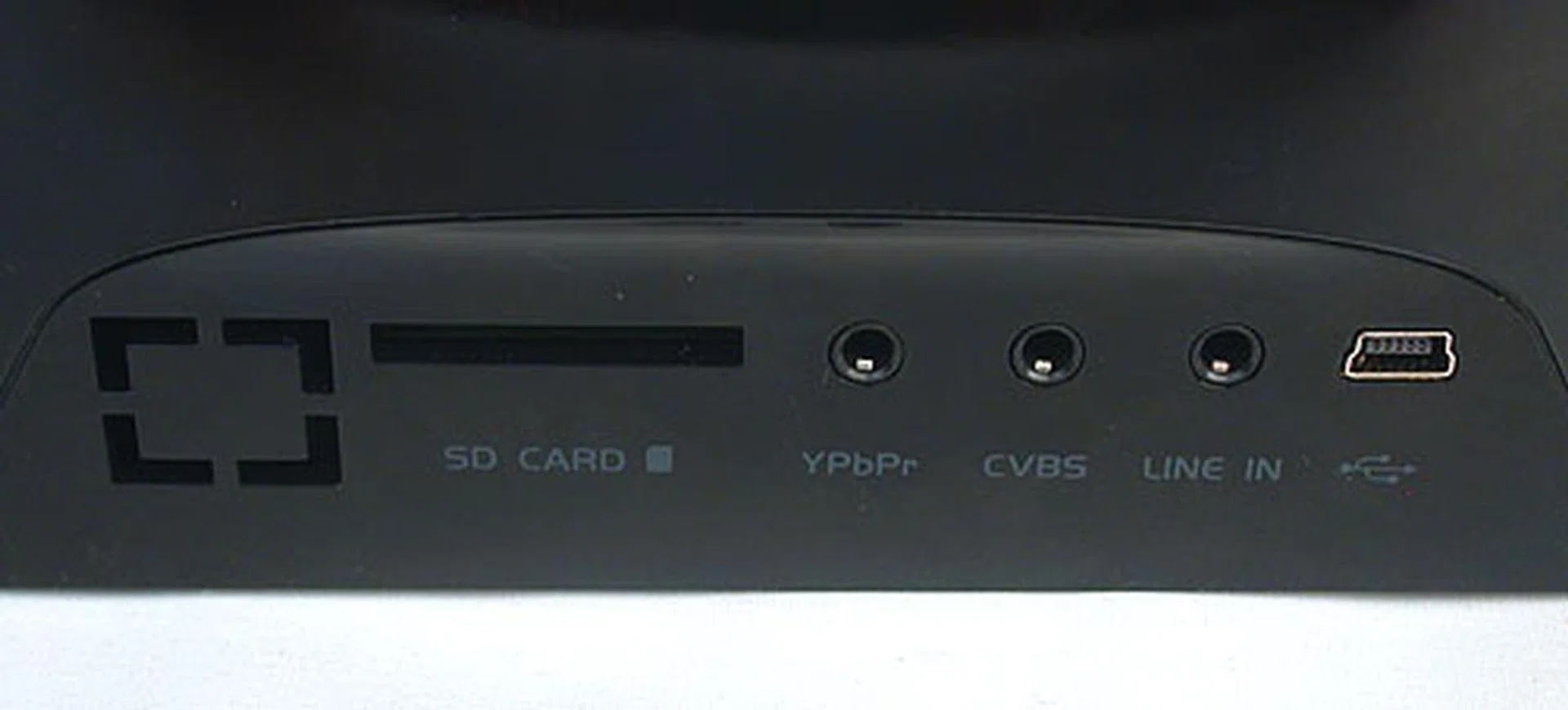 There's a line-in for audio and it also has video out, but there's no way to output the audio to better speakers than its rather tinny ones. You can power the device using the miniUSB port and play content from a SD card. While there's internal storage, we have no idea how much as it was not stated.