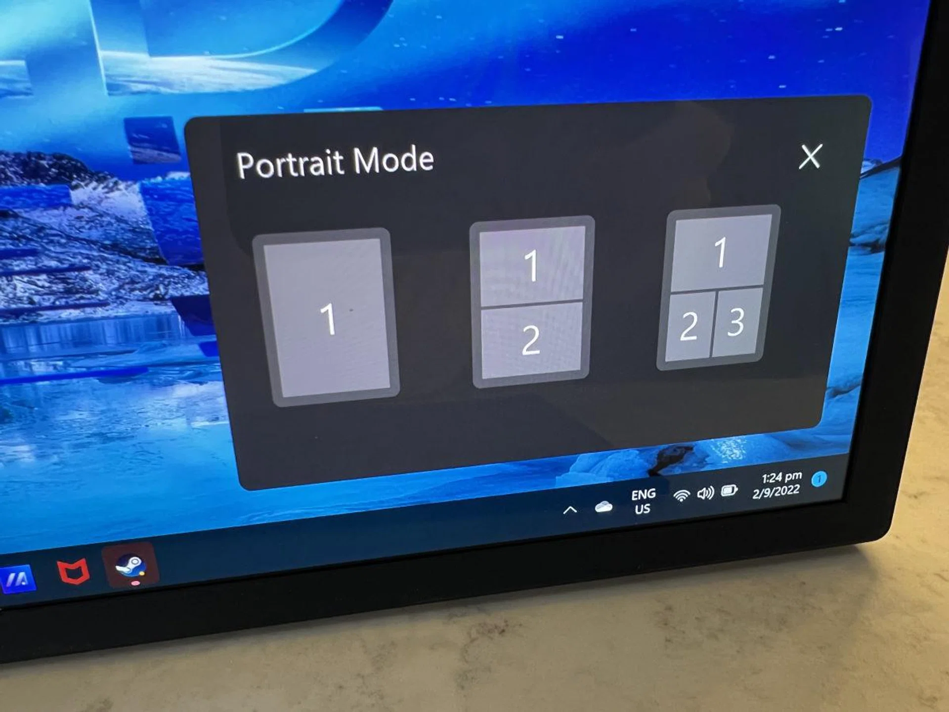 ASUS software does detect when you fold and unfold the notebook and offers some preset window tiling options, though you can easily snap your apps in Windows 11 manually to your preferred quadrants.