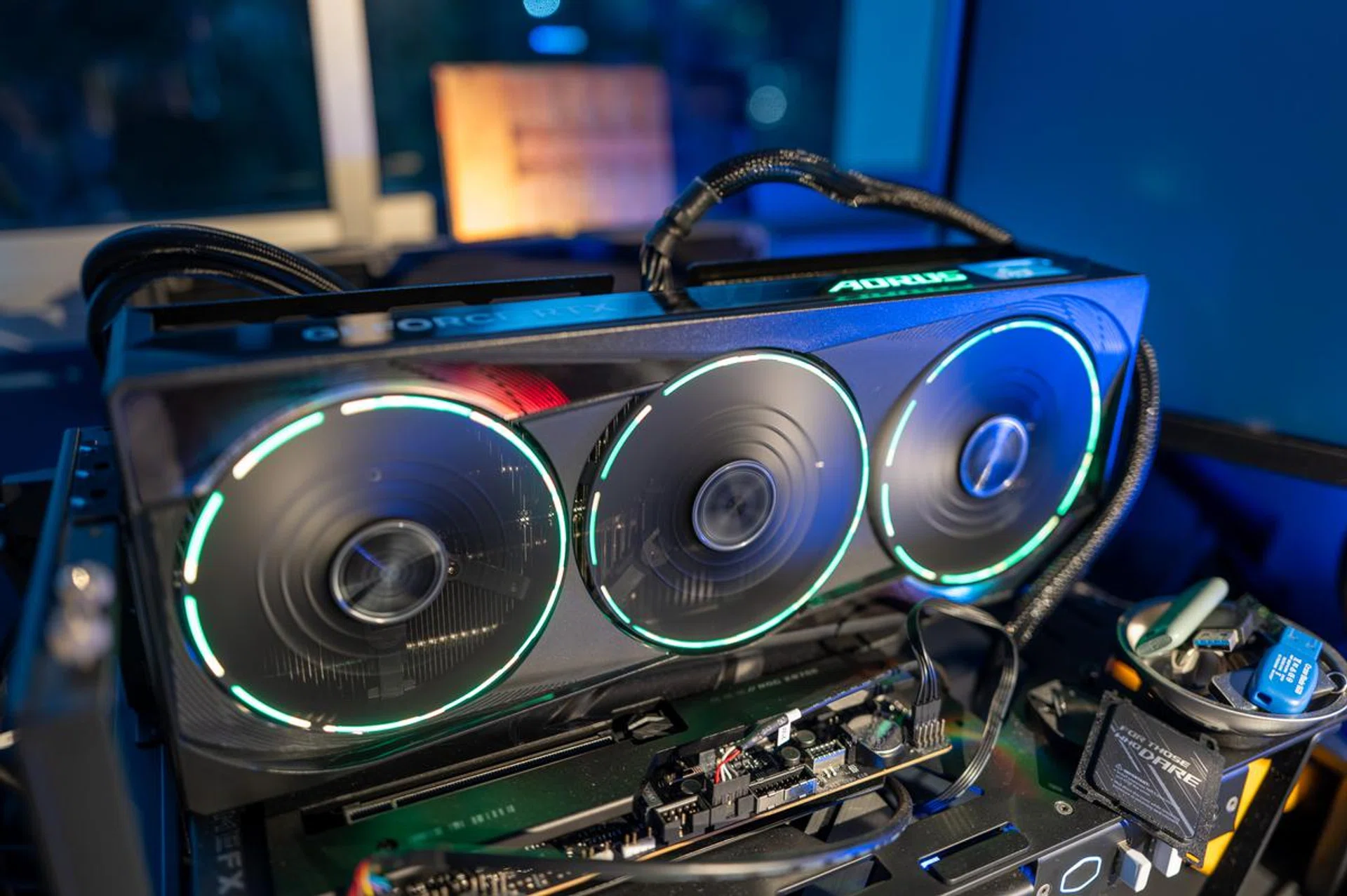 The card retains the same triple-ring RGB Halo lights that encircle each of the three new “Hawk” fans. (Image: HWZ)