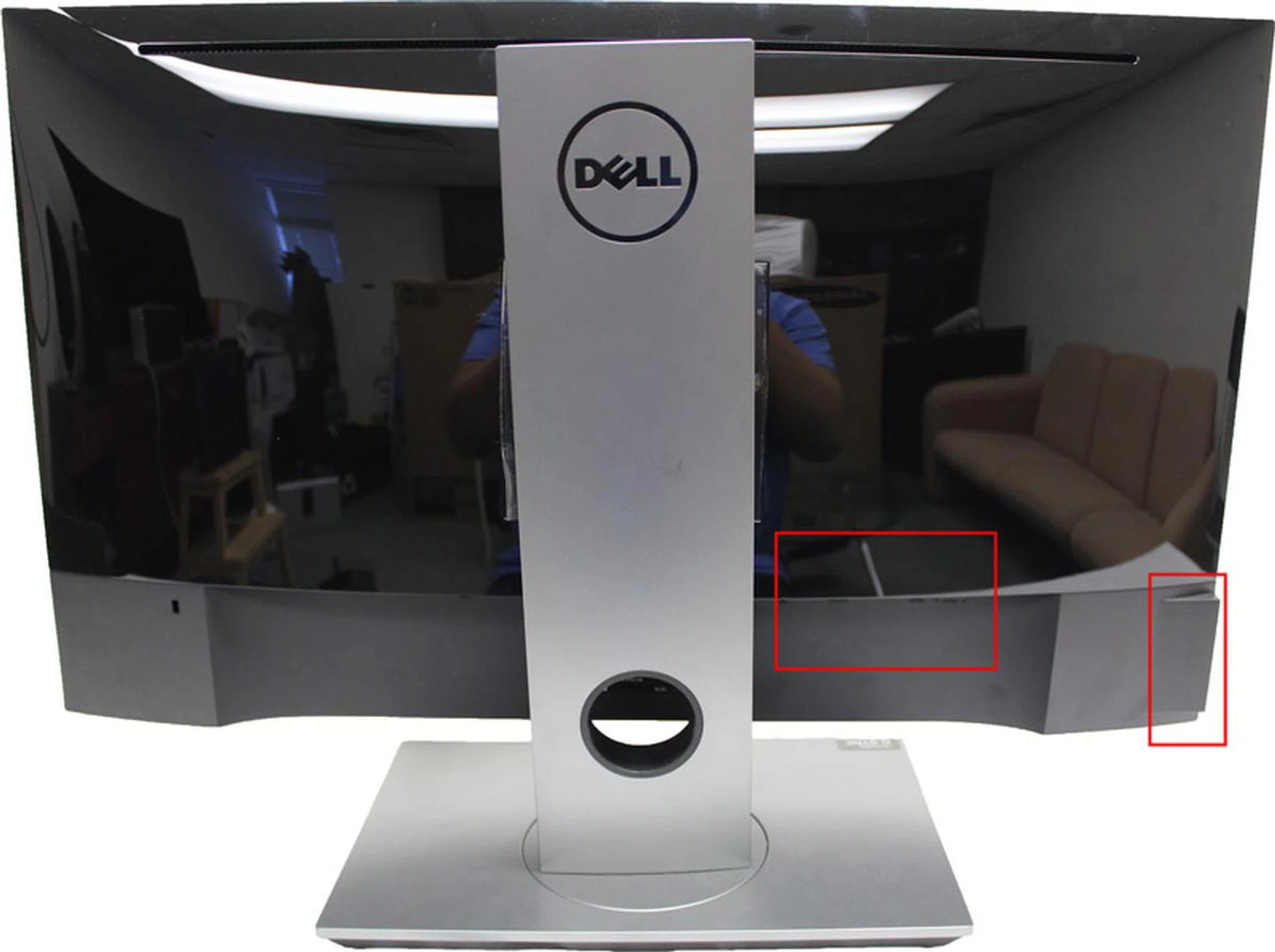 The Dell monitor has a glossy rear back. The red rectangles highlight the locations where the USB ports are located.