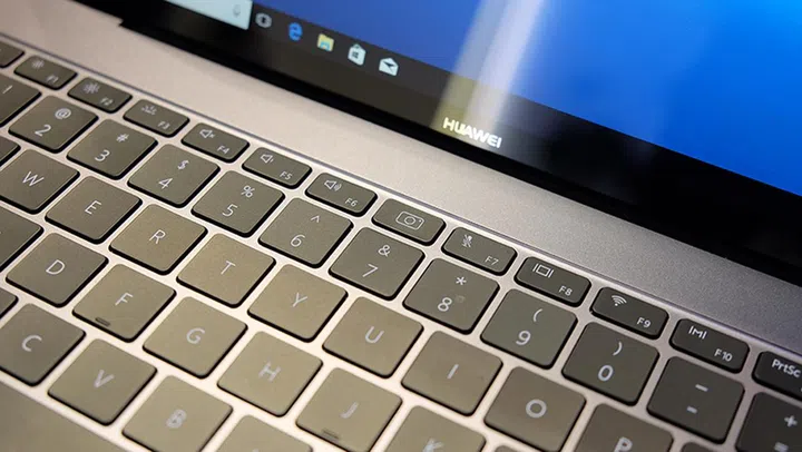 The webcam sits between the F6 and F7 keys.