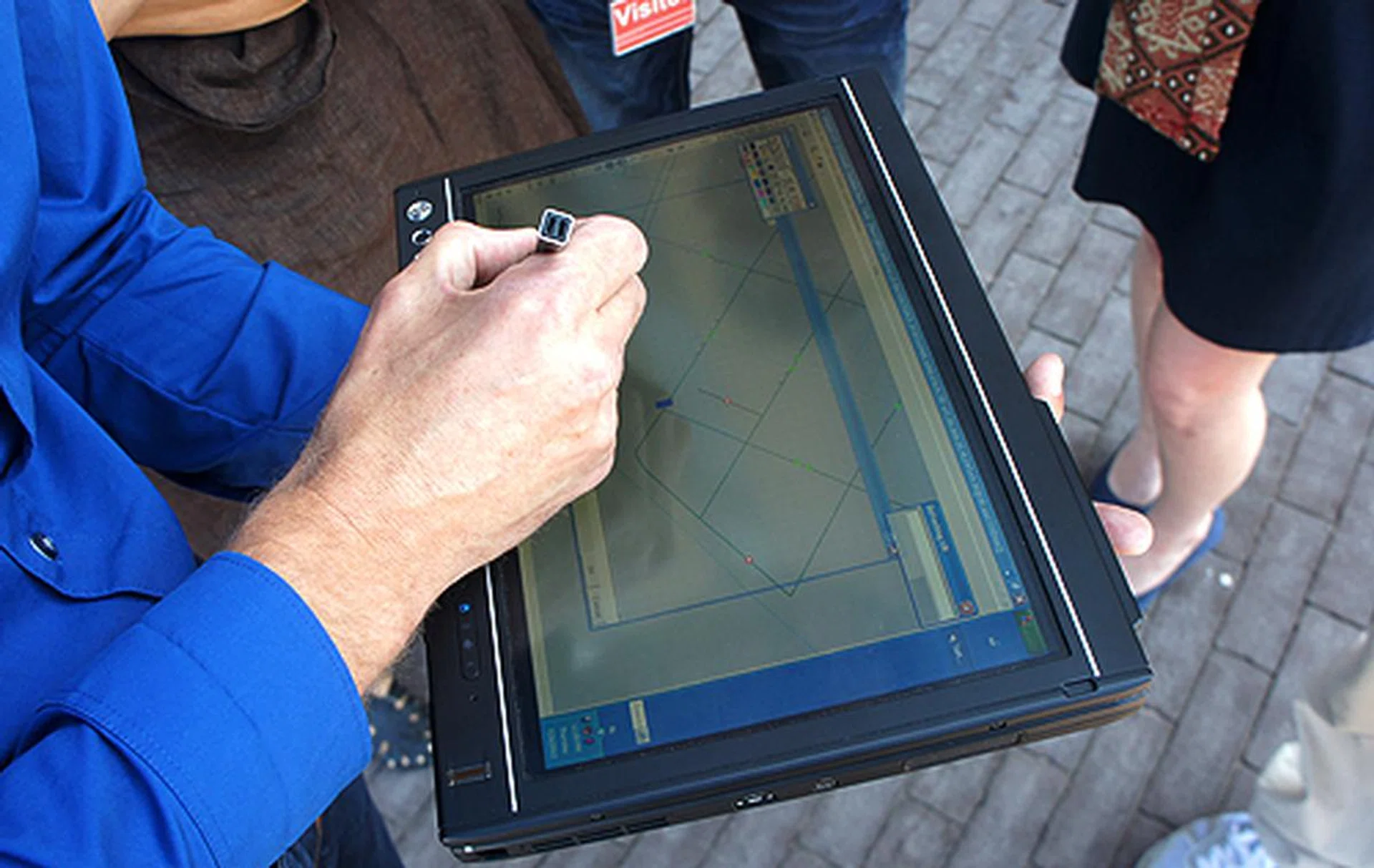 Using a tablet computer and TomTom's proprietary software, field staff can make changes to the base map which are then uploaded to TomTom's main map servers.
