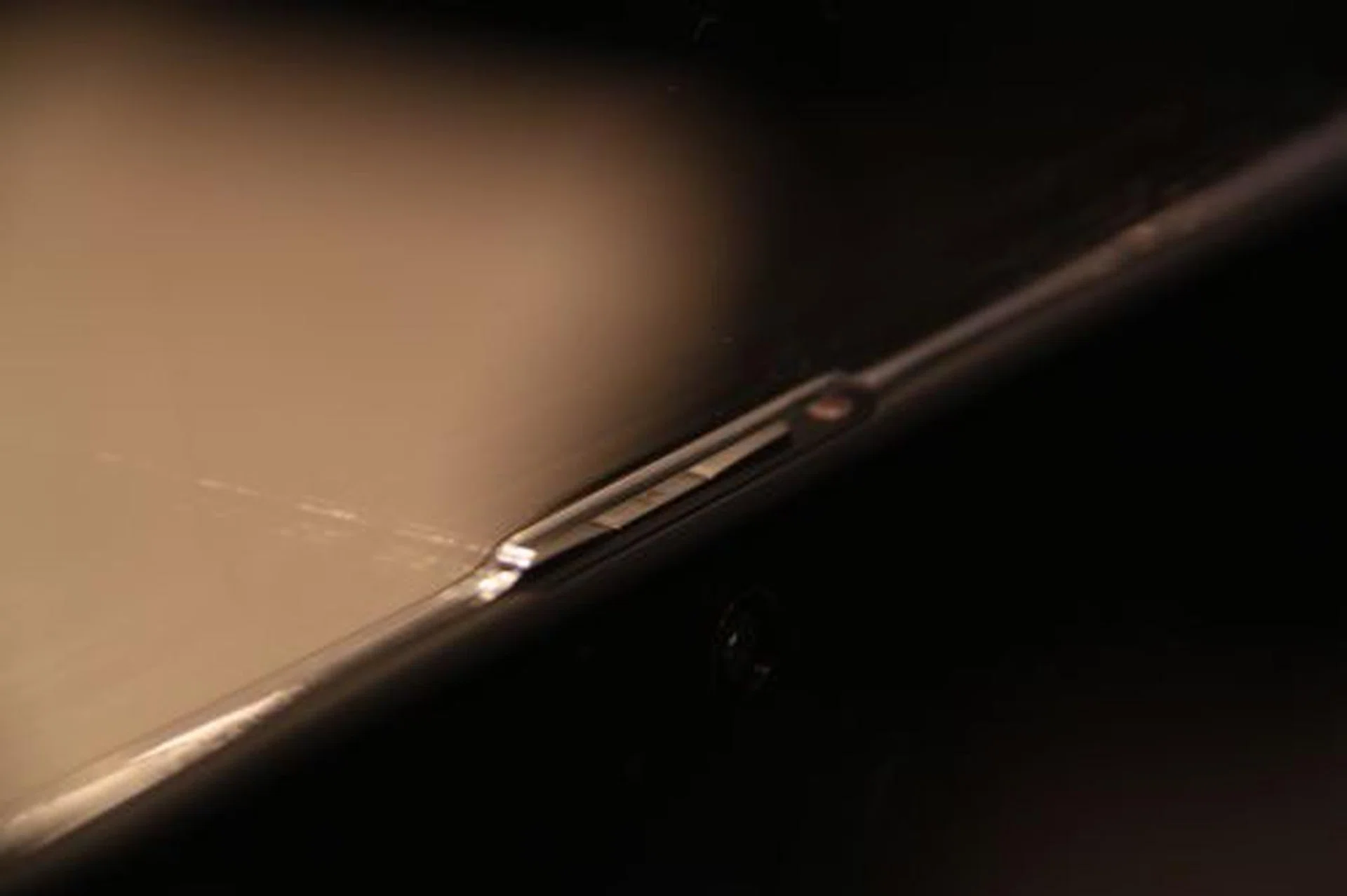 Based on what we've seen in press photos and this shot we managed to take, the top portion of the PlayBook has four buttons. Three left, right and play/pause buttons, and one Power button.