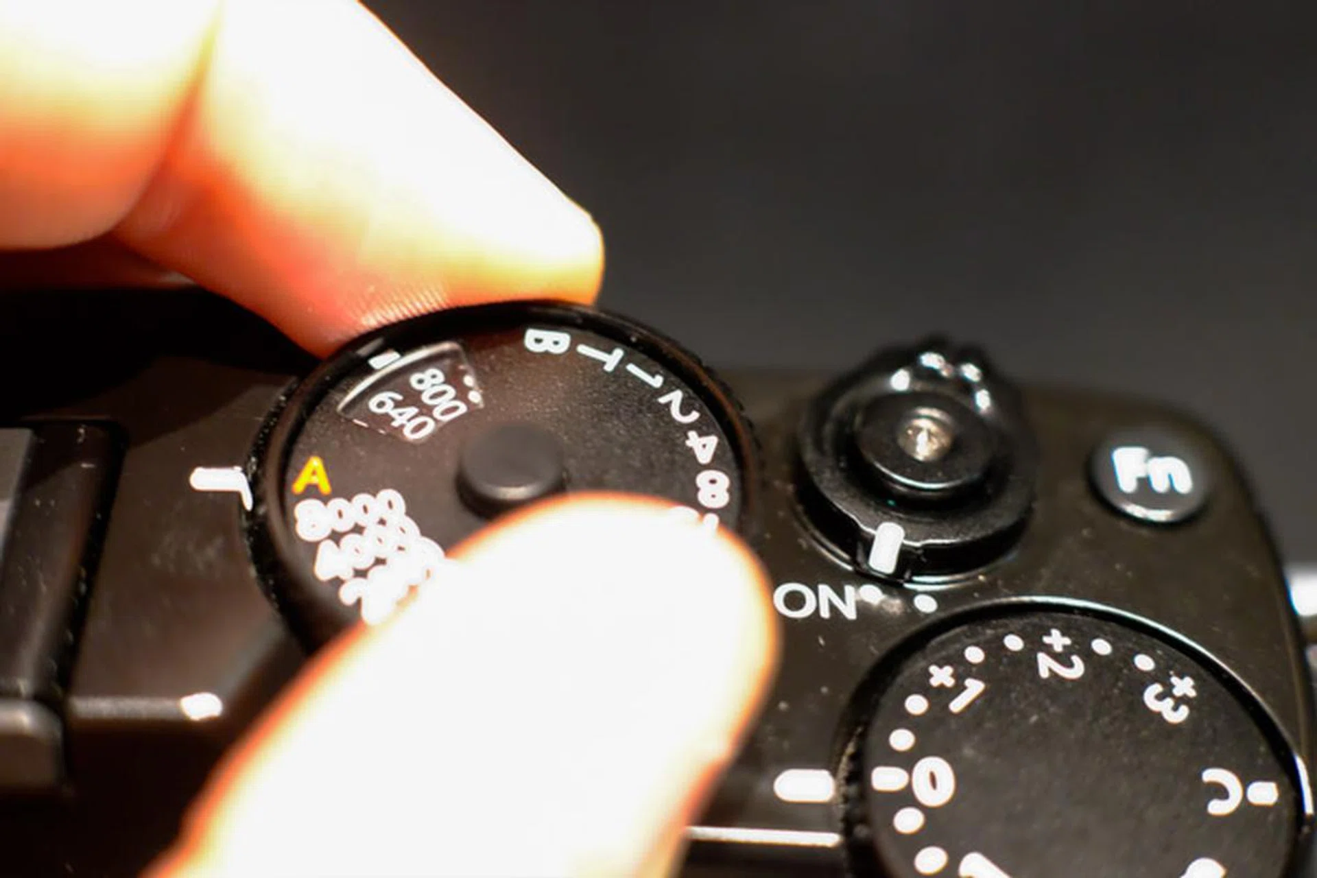 To adjust ISO, you need to lift up on the sides of the shutter dial. 