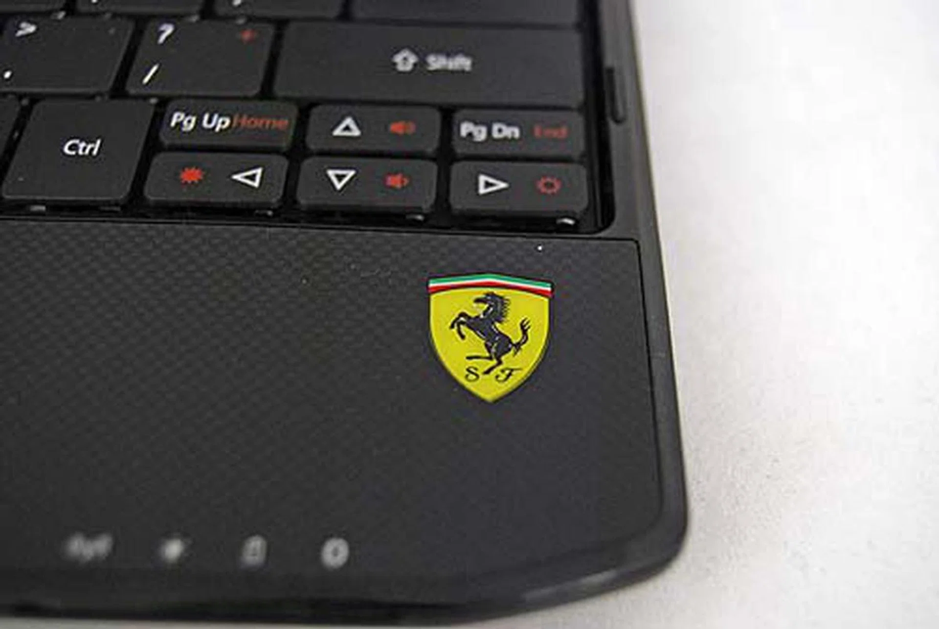 Lastly, the palm rest features a carbon-fiber like design and the Ferrari logo again for a reminder that it's a Ferrari inspired machine.