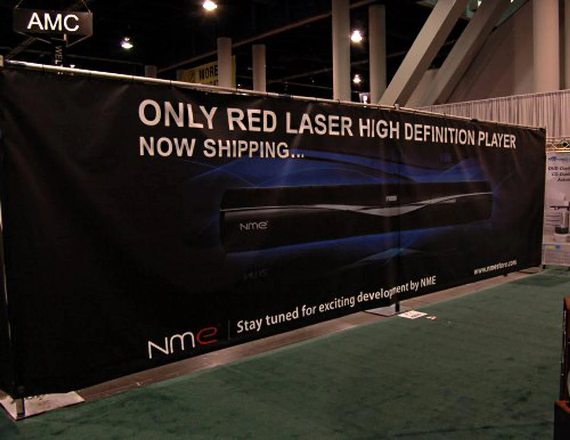  NME's Red Laser Blu-ray/HD DVD competing technology HD VMD was supposed to be at CES this year, but all we got as an empty booth lot surrounding by this poster.  