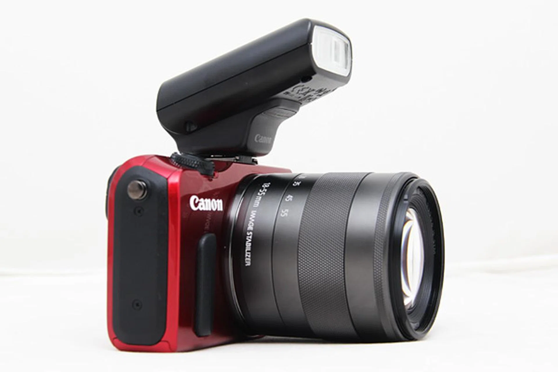 The Speedlite flash attachment adds substantial bulk to the EOS M when attached.
