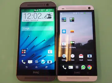 The HTC One (M8) retains some aspects of its design language from its predecessor (right) and the front-facing BoomSound speakers. Improved is the slimmer 'bezel' and its soft keys. Say goodbye to the dreaded fixed touch keys of the former HTC One series.