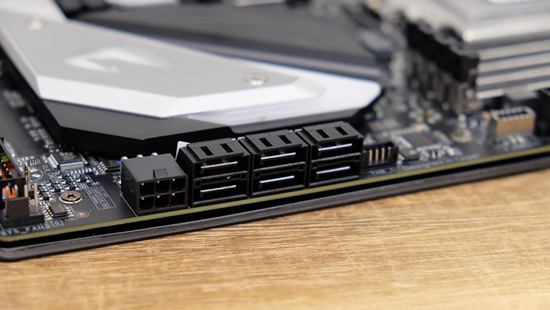 There's a 6-pin PCIe power connector beside the SATA ports to supply extra power to the GPUs.