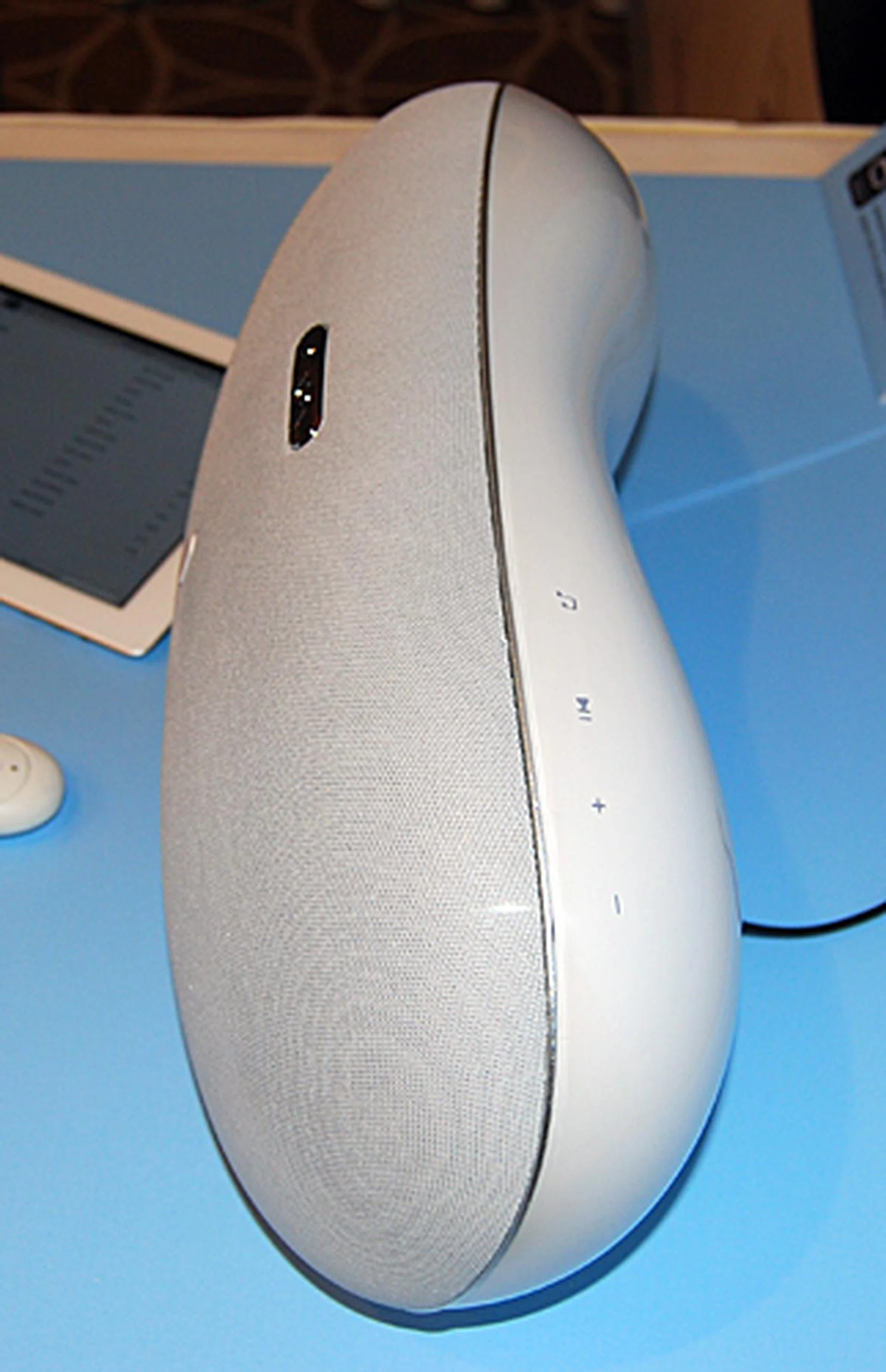The side view of the Denon Cocoon Home effectively shows the curved nature of its design.