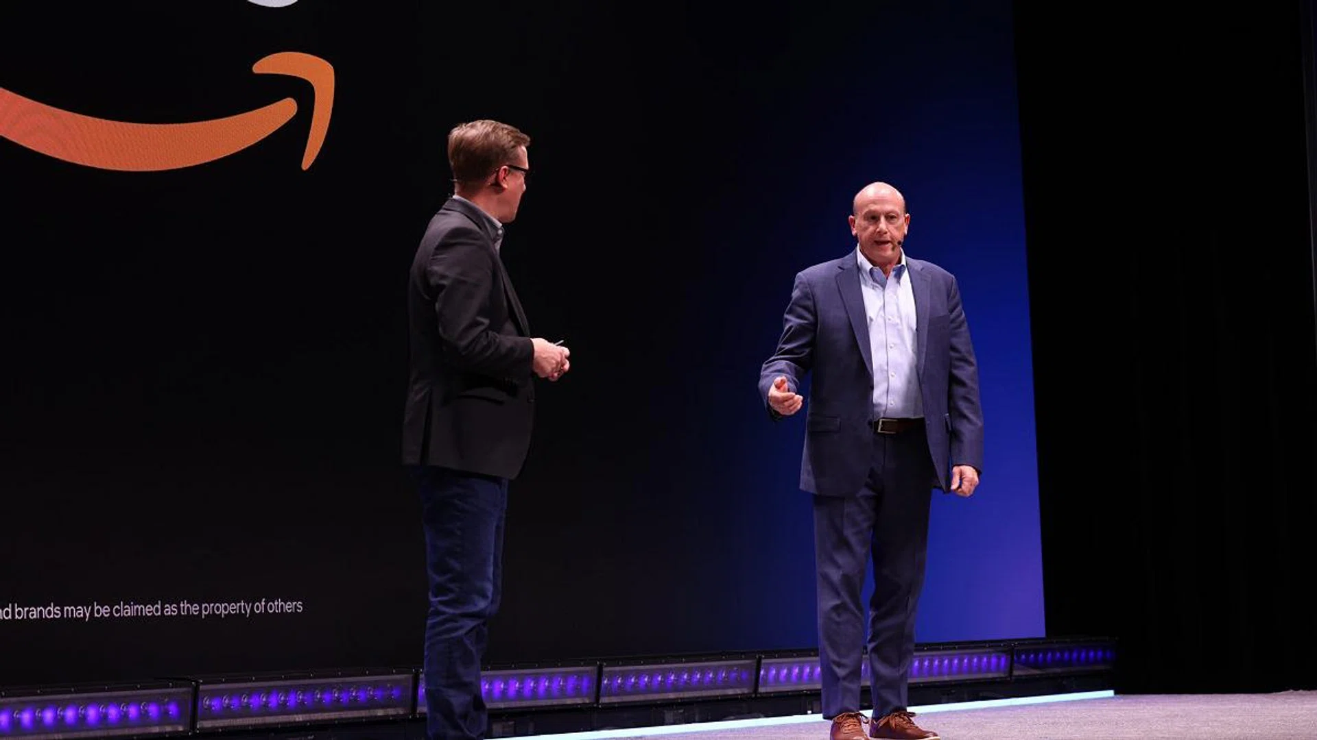 Rob Boetticher, director of Automotive Solutions Architecture at Amazon Web Services (AWS), joins Jack Weast, VP of Intel and GM of Intel Automotive, on stage at CES to announce the Intel Virtual Development Environment (VDE) on AWS. (Image: Intel)