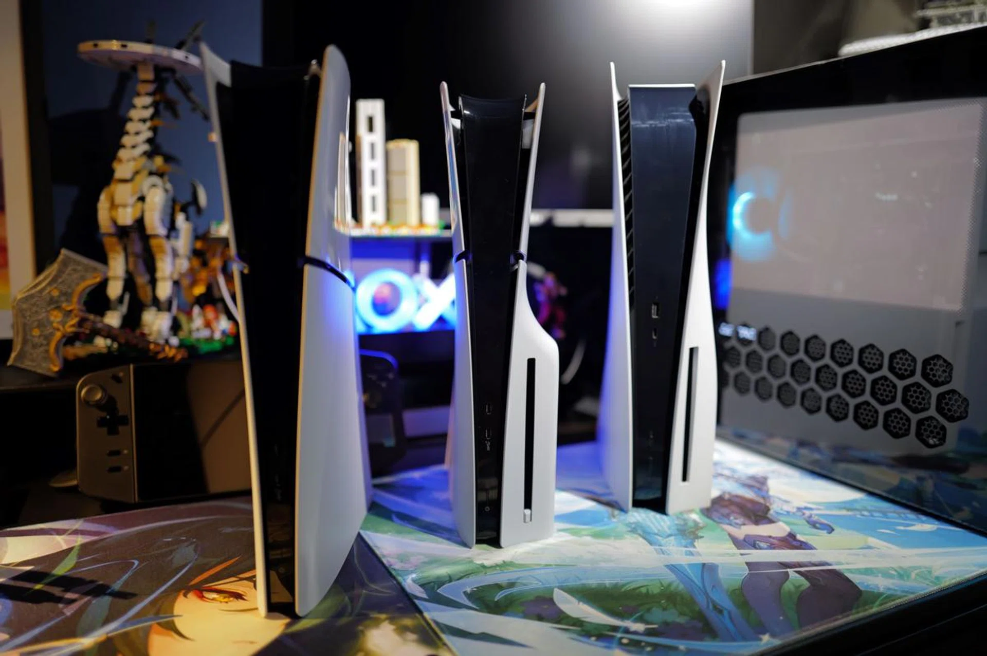 From left to right: PlayStation 5 'Slim' Digital Edition, PlayStation 5 'Slim', and the original PlayStation 5