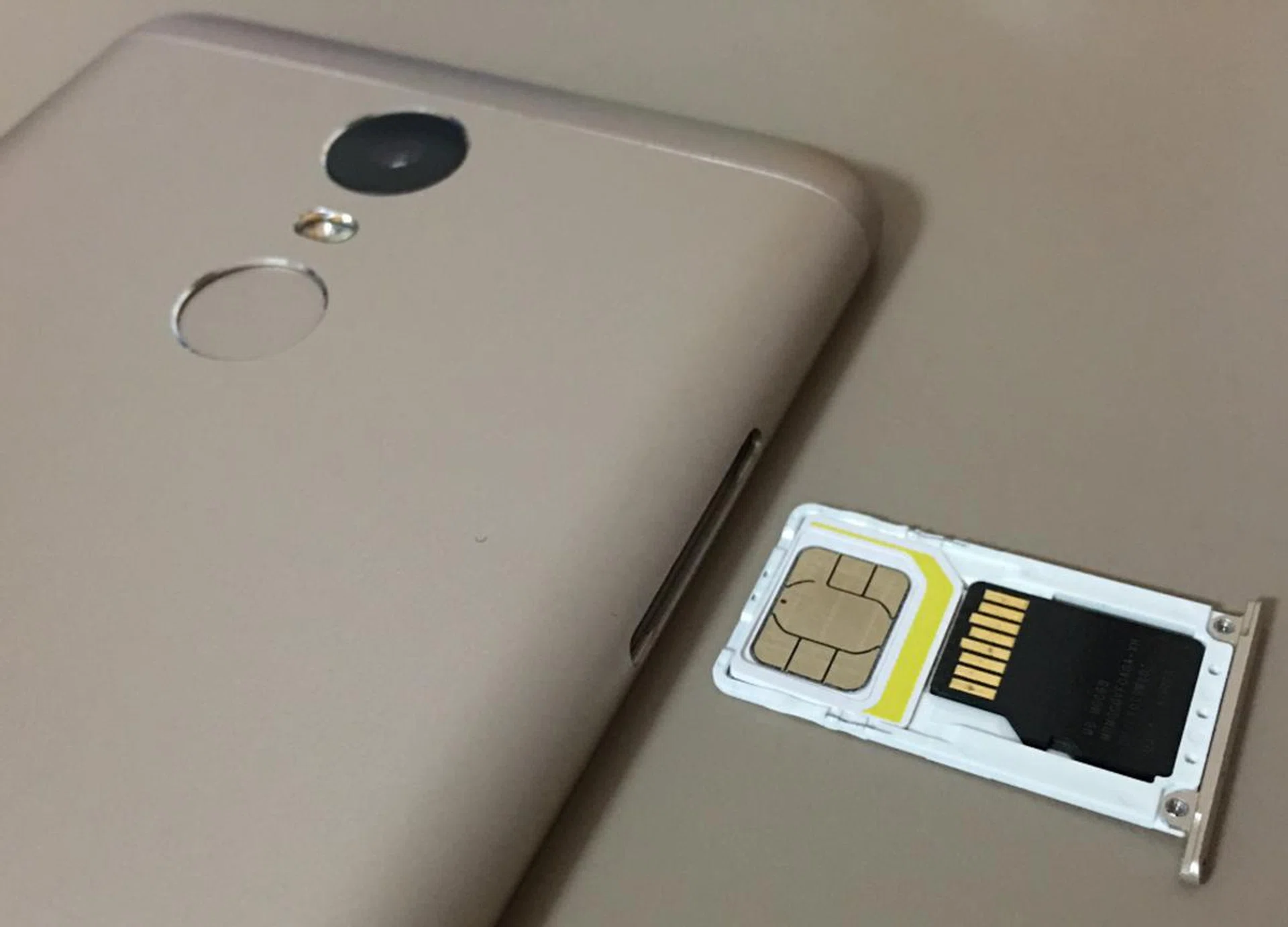 SIM card slot 1 and the micro-SD memory card slot (in place of SIM card slot 2).