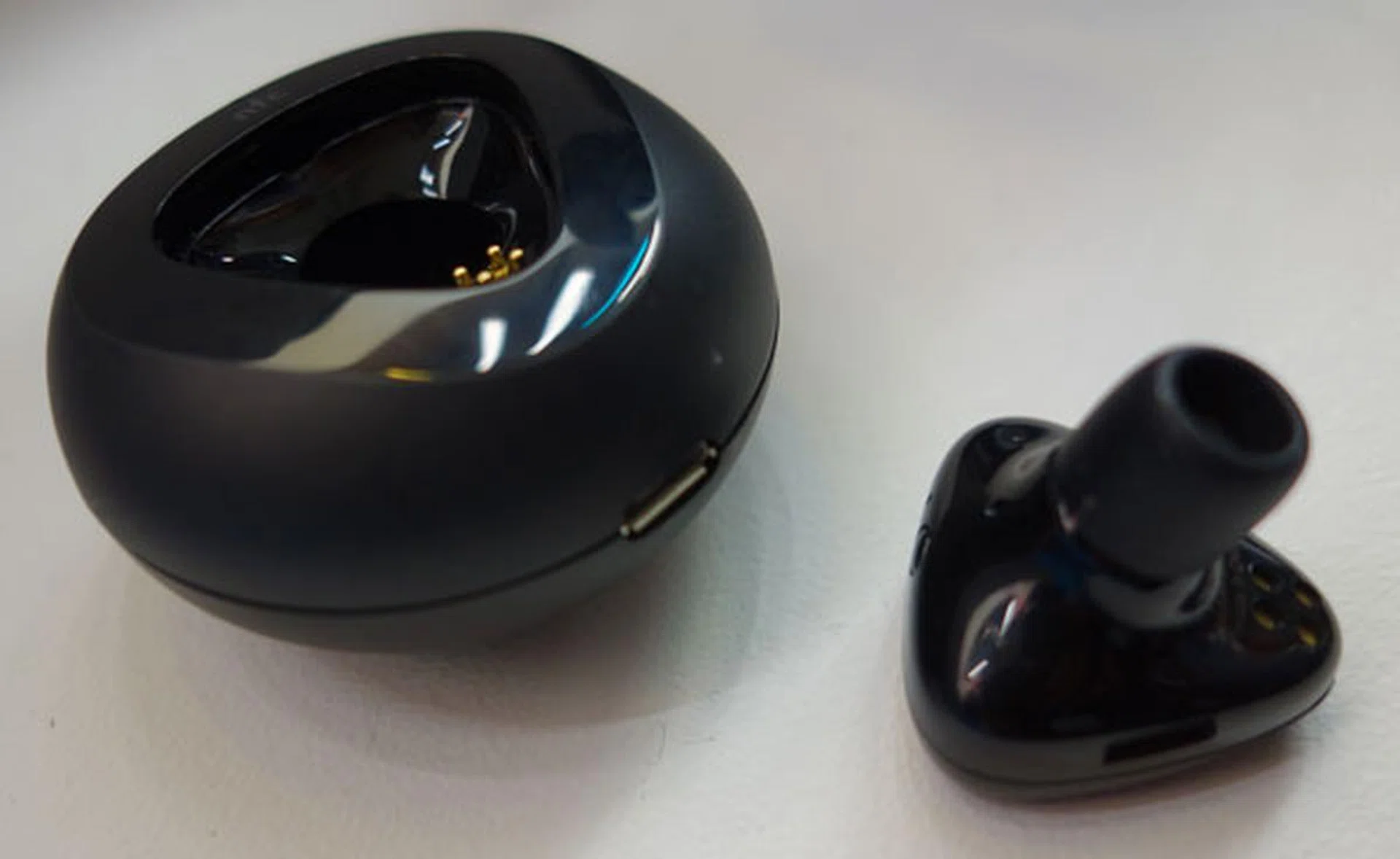 The Nokia Luna, a handy Bluetooth headset that fits into a pebble-shaped charger. Pairing is made easy with NFC.