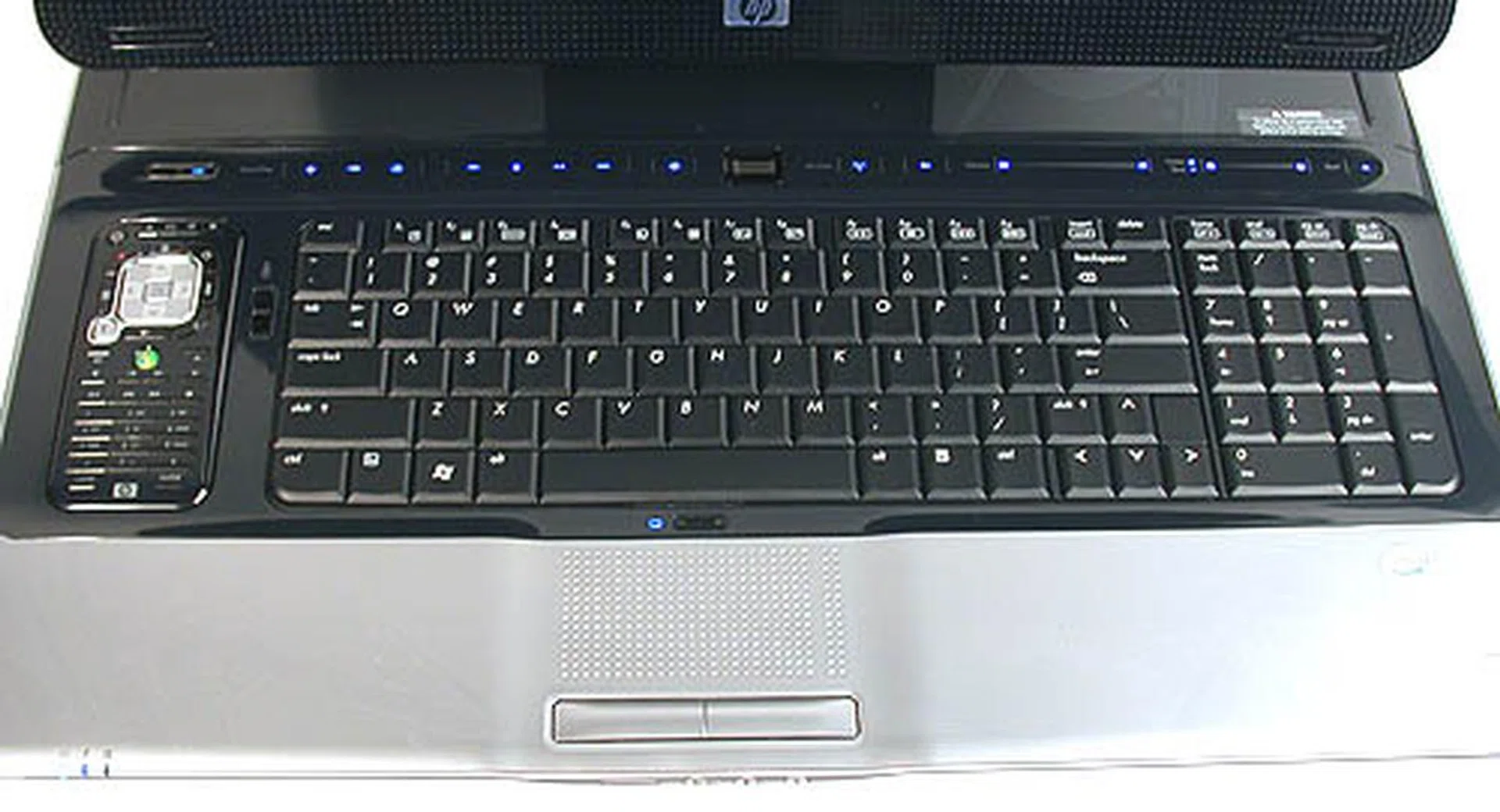 A practically full sized keyboard takes advantages of the extra amount of 'desk space' afforded by the large display. There's even a small dock for the remote on the left. 