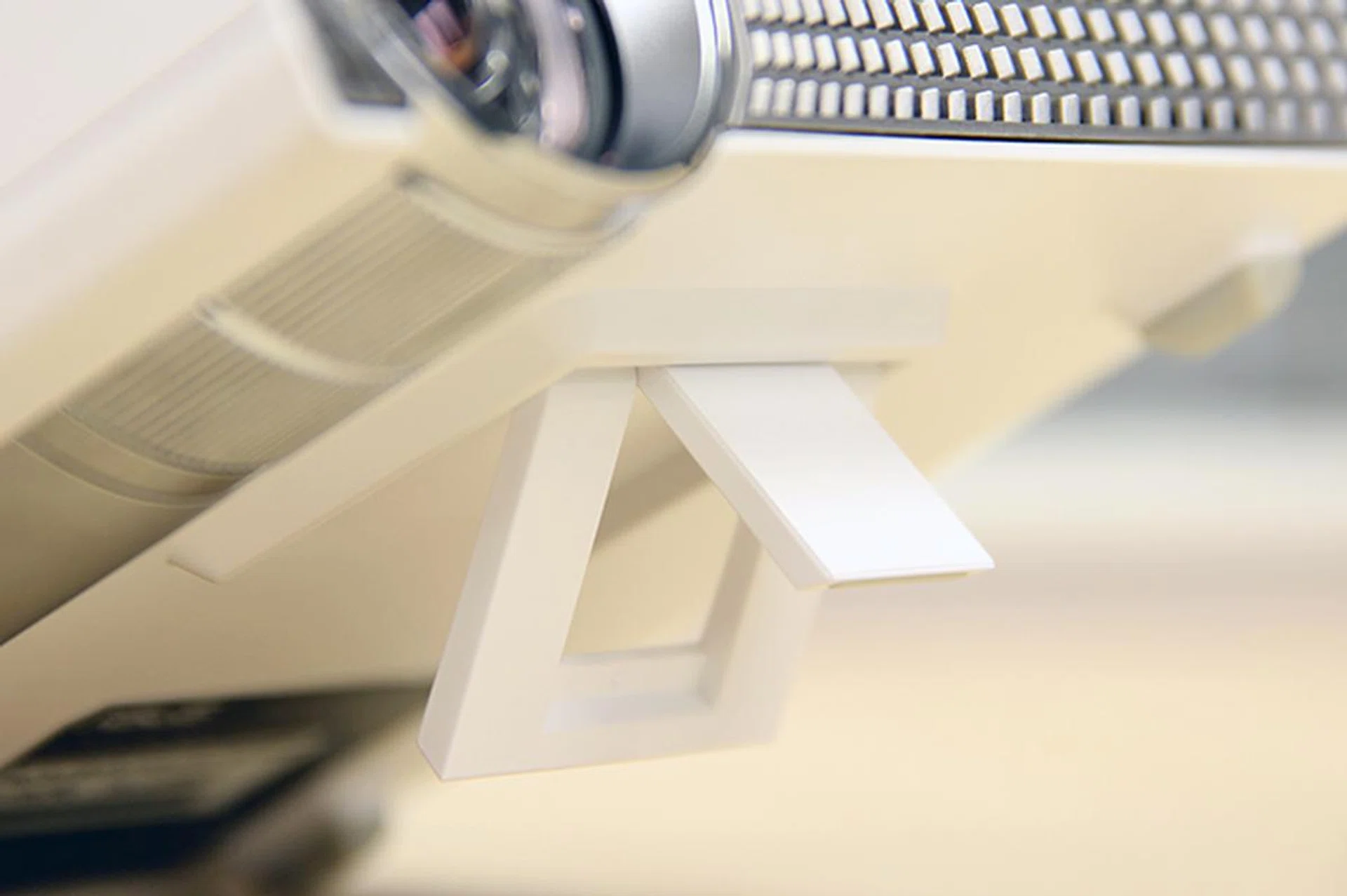 For height adjustment, you've to rely on the 2-way flip-down stand at the bottom of the projector.