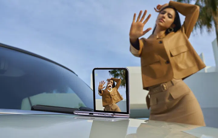 Gesture-controlled selfie with the Tecno Phantom V Flip 5G.