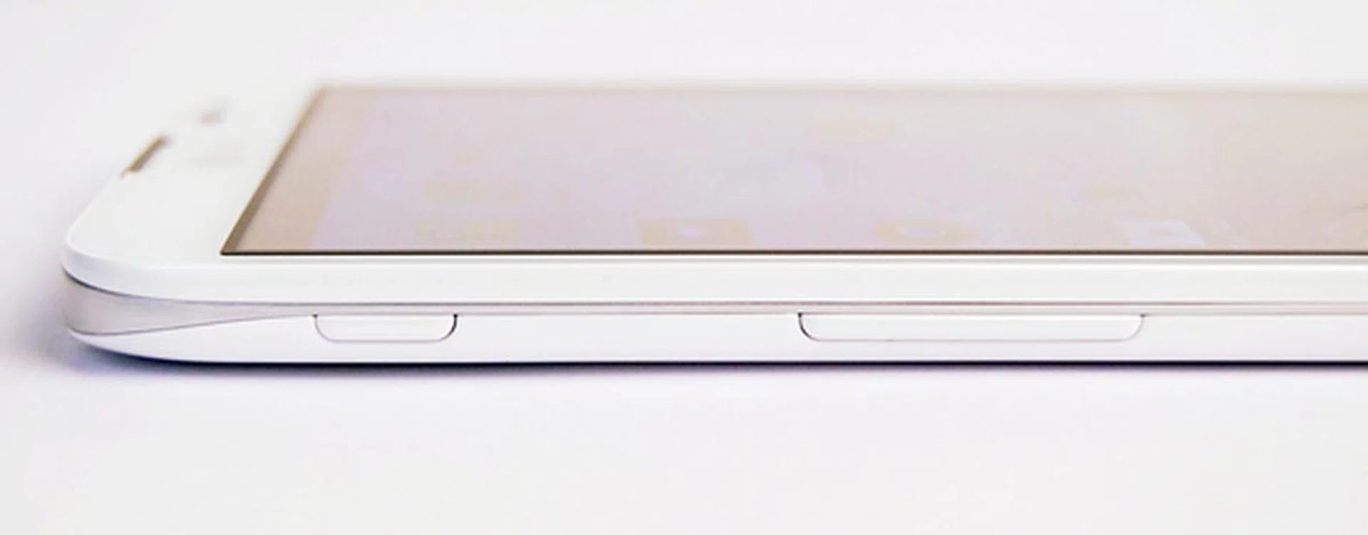 You will find the Q Button (shortcut button) and volume controls on the left side of the LG Optimus G Pro. By default, the shortcut button activates the QSlide feature.