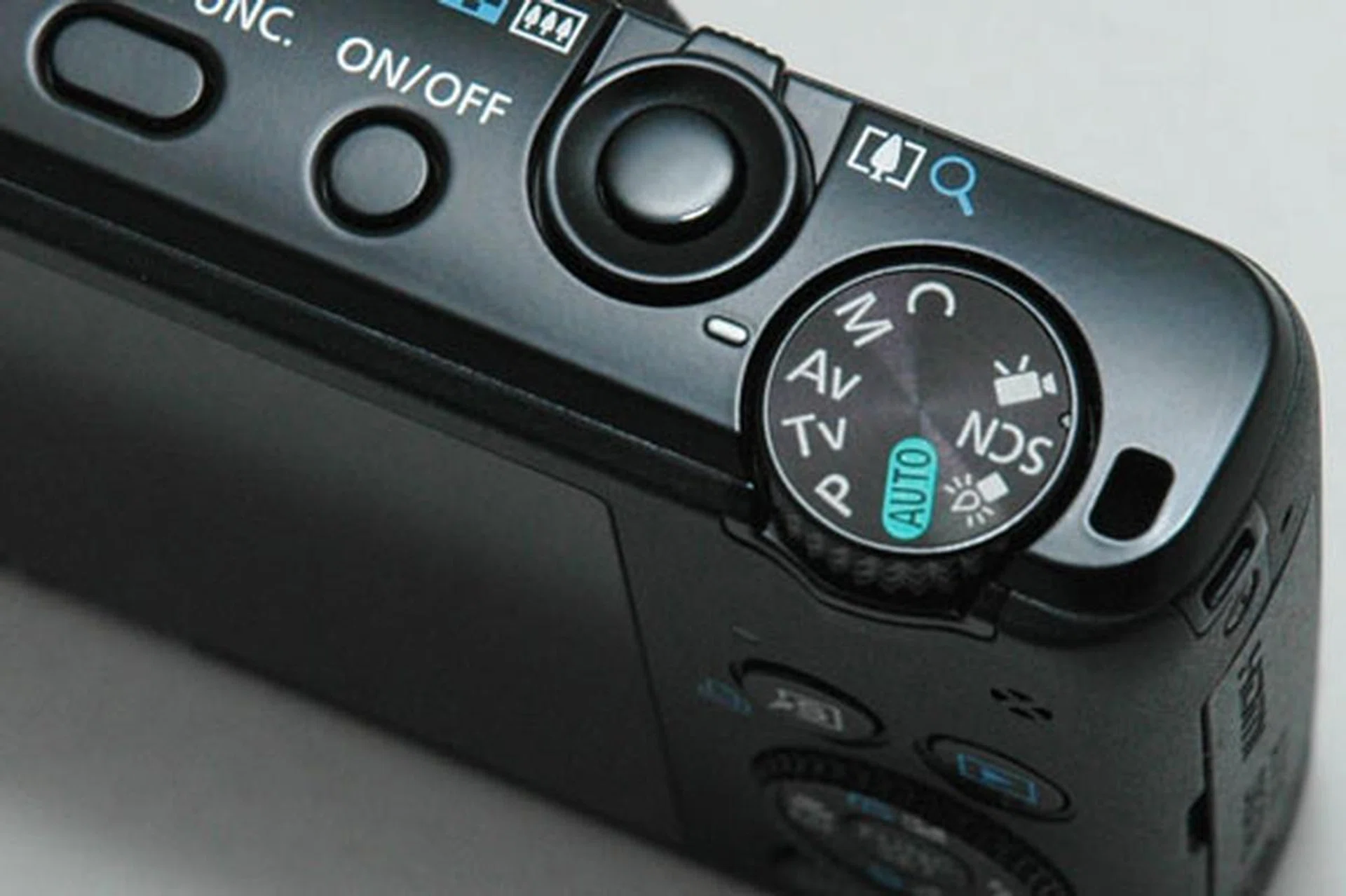 The On/Off button is now a different shape, but the S95 still has a very stiff Mode dial.
