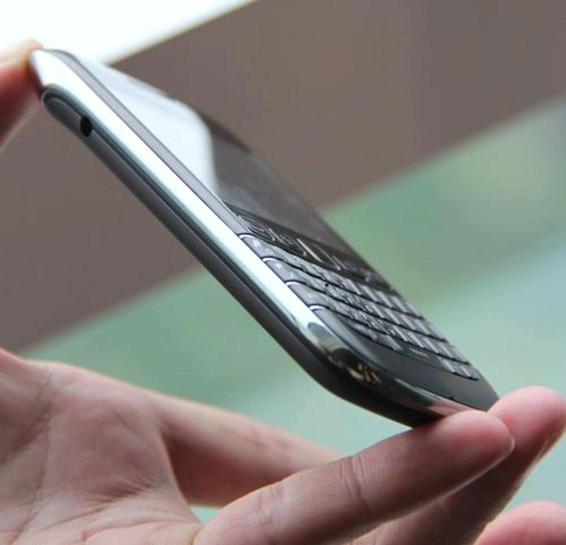 The BlackBerry Bold 9790 boasts a 2.45" touch-screen display with a QWERTY keyboard. Notice how much effort has been made to flush the keyboard to the sides while the curve of the bezel gives the illusion of optimal real estate usage for the display.