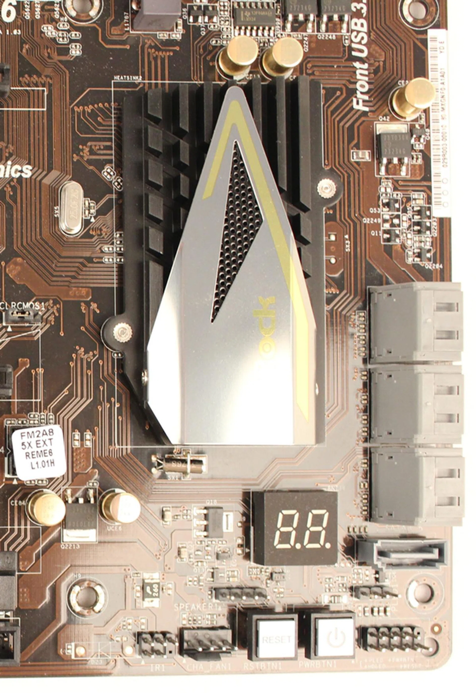 To the right of the chipset heatsink, there are the SATA 6Gbps connectors. There is also a lone SATA connector whose orientation is vertical, unlike the other six that have a 90 degree orientation.