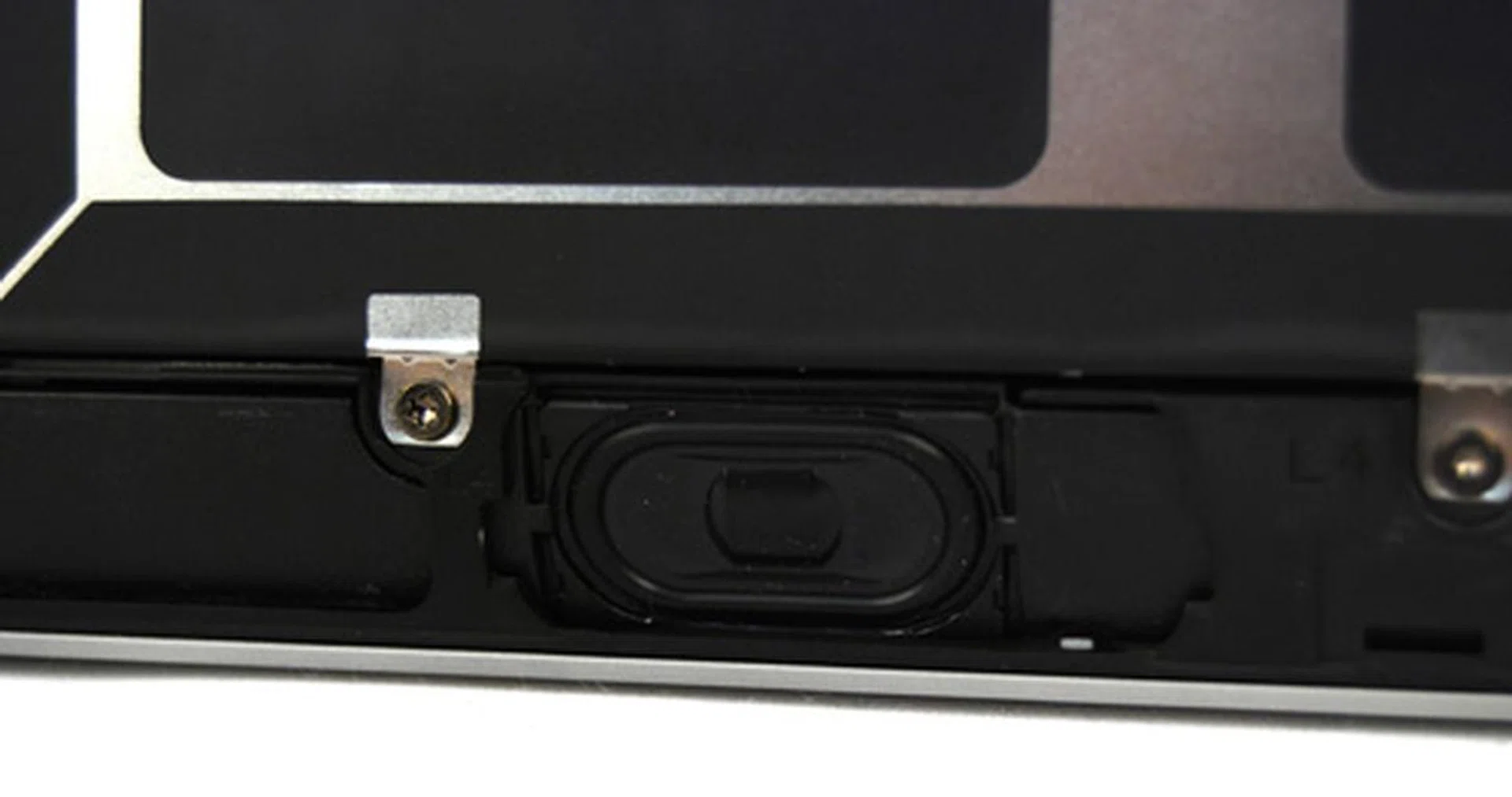One of the Spectre's two front facing speakers shown here with the notebook's base plate removed.