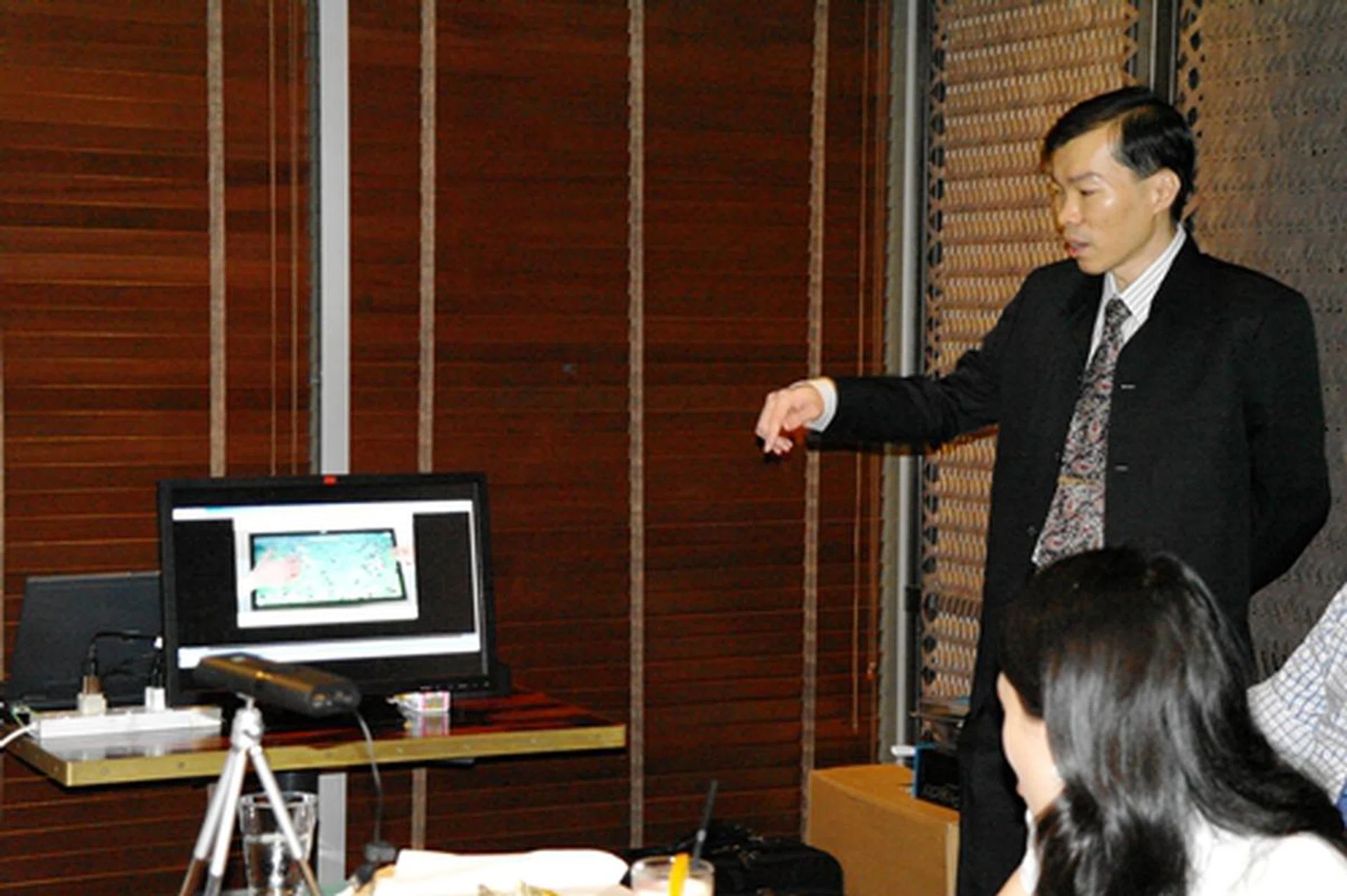 Mr. Dennis Hoon, Business Development Manager, 3M Touch Systems showing a video demonstration on playing games on the 3M M2256PW Multi-Touch Display...