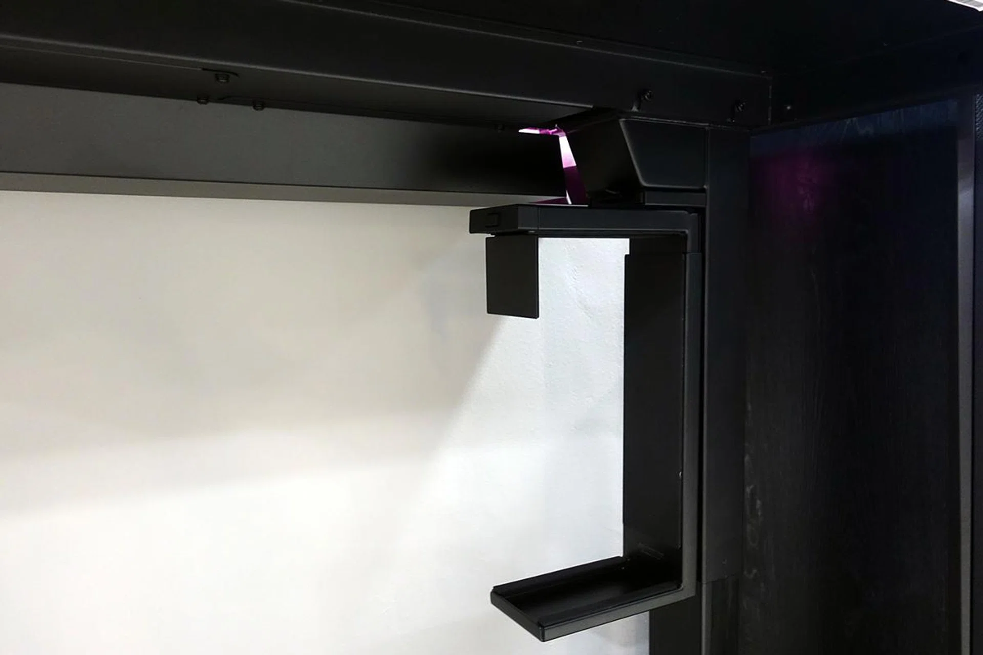 The PC mount is secured to either motorised leg by four metal screws.