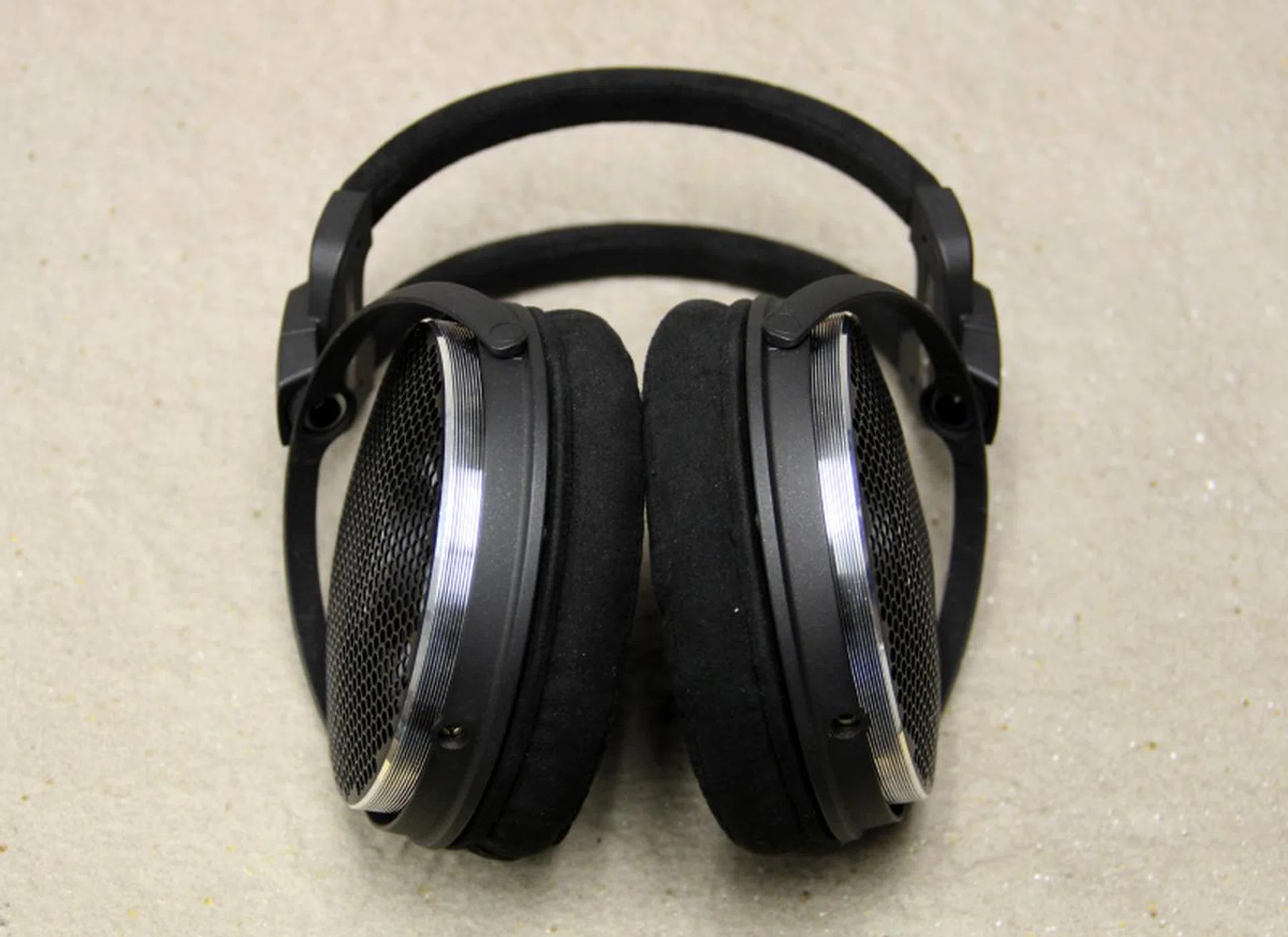 The ear pads are fairly shallow.