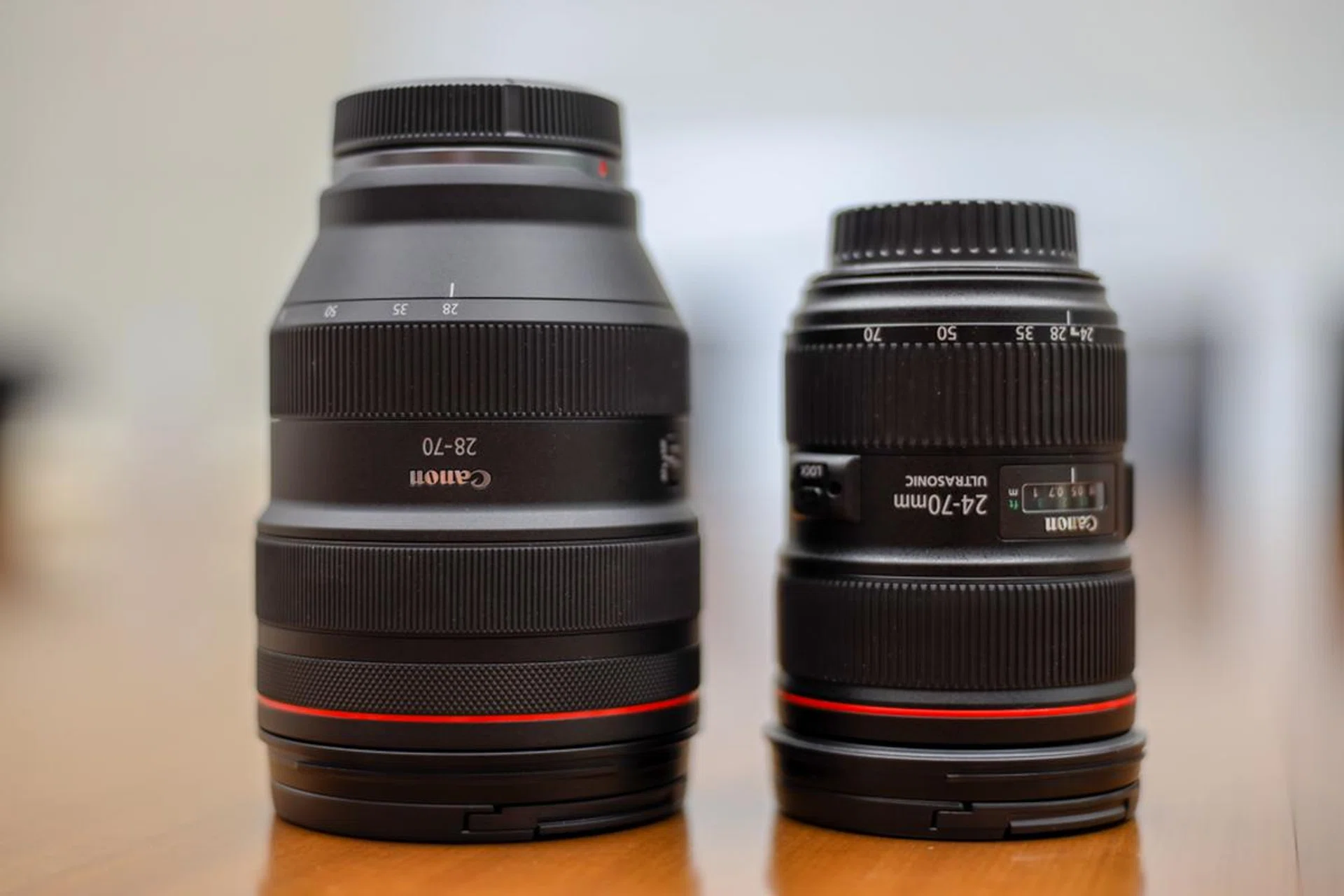 The 28-70mm f/2 RF lens (left) and the 24-70mm f/2.8 EF lens (right).
